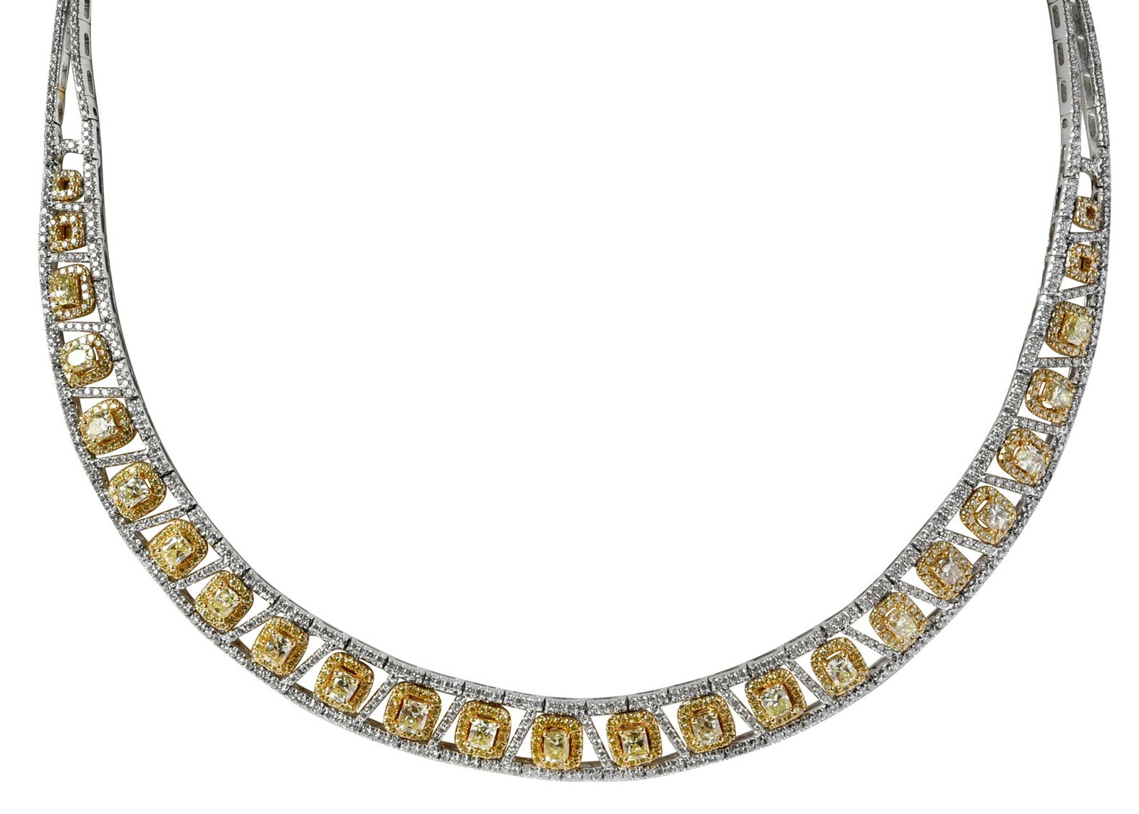 18kt. Fancy Yellow and White Diamond Collar Necklace: 21 light fancy yellow cushion cut diamonds, approx. 4.50ctw., VS-SI, accented with over 800 round faceted diamonds, approx. 4.50ctw., tests 18kt. white and yellow gold, 16 in. inside measurement, 11.0