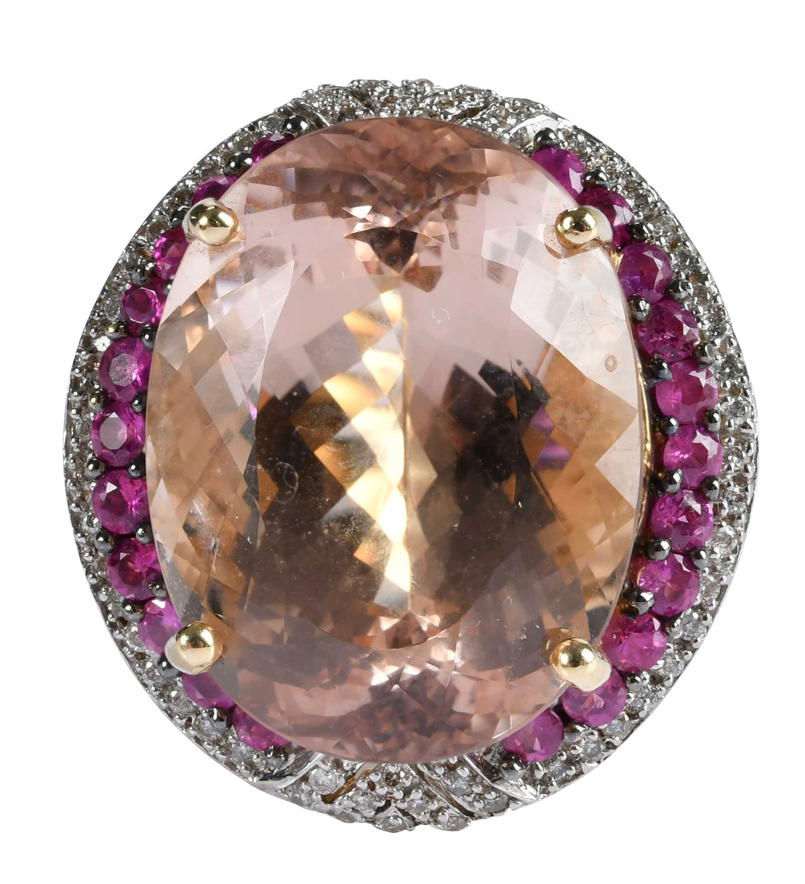 14kt. Morganite Beryl, Ruby and Diamond Cocktail Ring: oval Portuguese cut morganite, 22.0 - 17.0mm, approx. 26.00ct., 22 round faceted rubies, accented by round faceted diamonds, marked "14K, TAL", yellow gold, 9 ring sz., 16.3 g Provenance: Private Coll