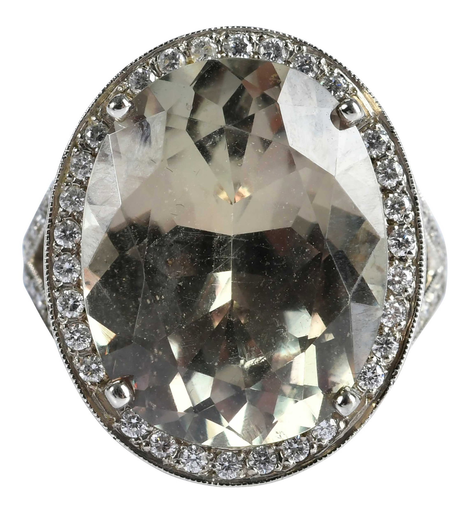 14kt. Color Changing Zultanite and Diamond Ring: oval faceted zultanite, approx. 14.86ct., 72 round faceted diamonds, approx. 0.50ctw., SI, H-J, marked "14K", white gold, 8-3/4 ring sz., four prongs, 8.5 g Provenance: Private Collection, Virginia Be