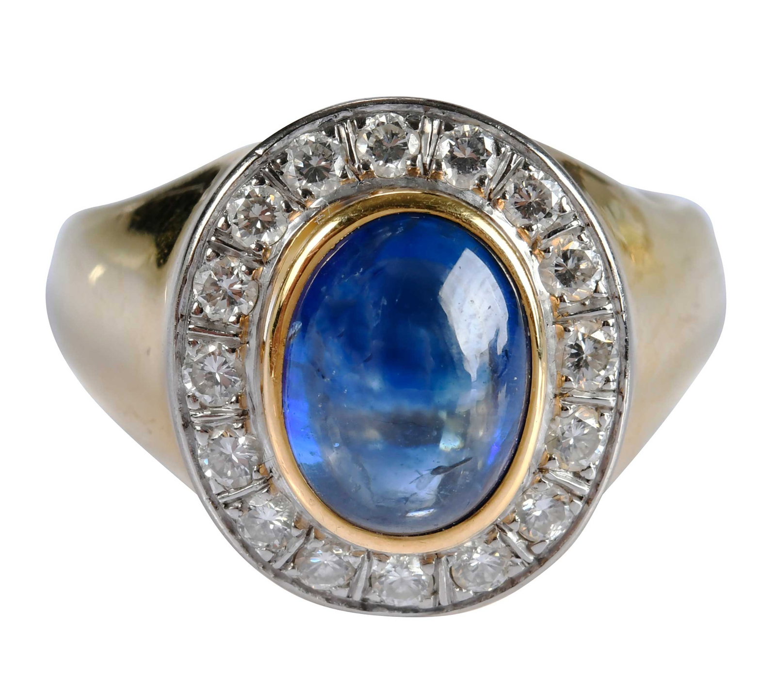 18kt. Blue Sapphire Cabochon and Diamond Halo Ring: oval cut blue sapphire cabochon, approx. 3.15ct., 16 round faceted diamonds, approx. 0.30ctw., VS, G-H, marked "B, 750", yellow gold, 3/54-/0 engraved, 9 ring sz., 10.4 g Provenance: Private Collectio