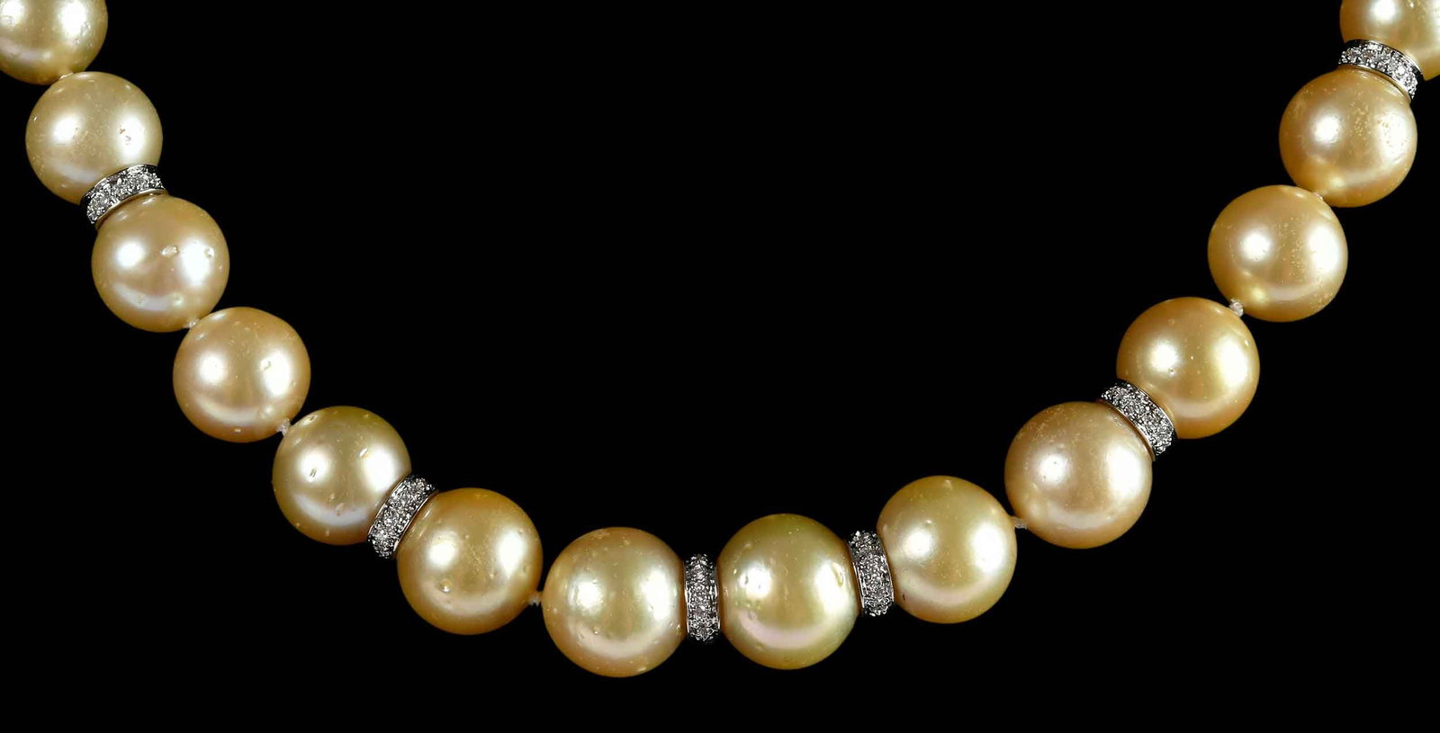 14kt. Single Strand South Sea Golden Pearl with Diamond Spacer and Clasp Necklace: 33 South Sea golden pearls, graduating in size, approx. 12.0 - 13.5mm, eight filigree 14kt. yellow gold beads, six spacers with round faceted diamonds, marked "14K, MS", yellow gold, 8.5mm diameter cl