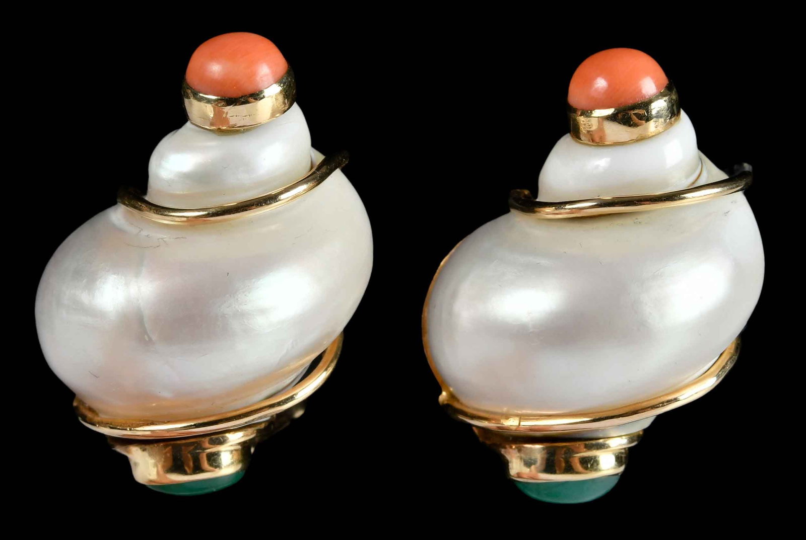 14kt. Seaman Schepp Emerald and Coral Turbo Shell Earrings: circa 1960, cabochon emerald and coral ends, signed Seaman Schepps, marked "14K", yellow gold, clip on backs, 1-3/8 in. length, 1 in. width, 33.3 g Provenance: Charlottesville, Virginia Collection Not