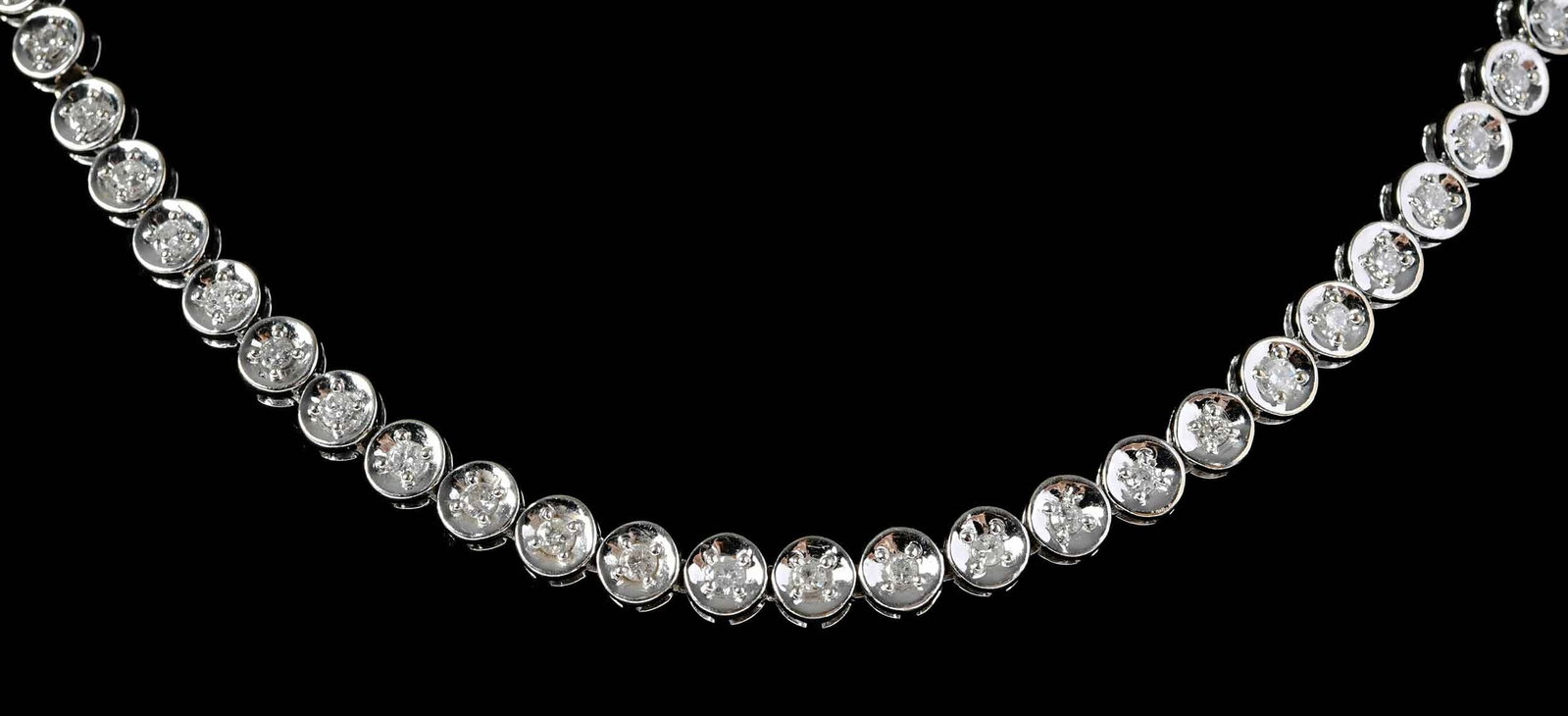 14kt. Riviera Style Diamond Necklace: 78 round faceted diamonds, approx. 6.65ctw., SI-I, G-I, marked "14K, USJ", white gold, 21 in. length, 7.0mm wide, 61.7 g Provenance: Private Collection, Virginia Beach Note: Accompanied by an appraisa