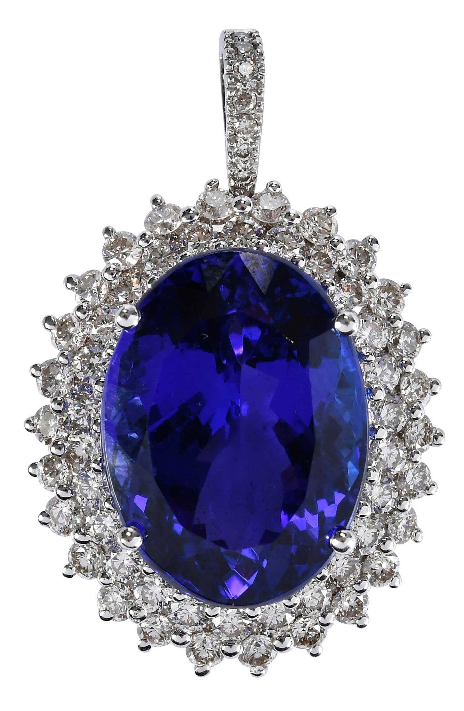 18kt. Tanzanite Double Halo Diamond Pendant: oval Portuguese cut tanzanite, approx. 19.30ct., 52 round faceted diamonds, approx. 2.15ctw., marked "750", white gold, 1-1/4 in. length with bale, 10.1 g Provenance: Private Collection, Virginia Beac