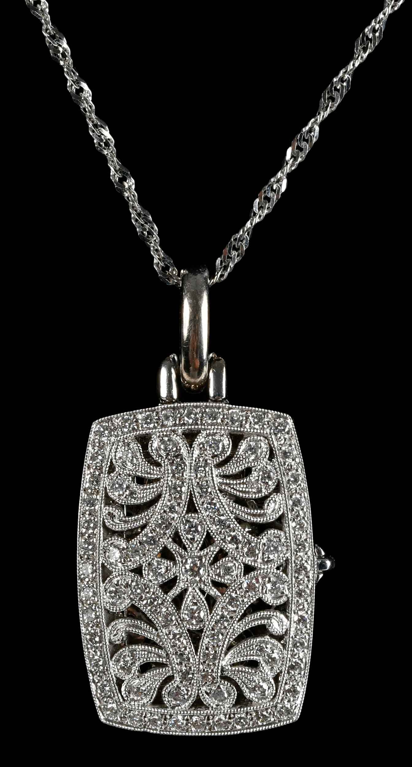 18kt. Open Work Diamond Locket on Chain: round faceted diamonds, marked "750", white gold, 1-1/2 x 3/4 in. overall design, 21.4 g; twisted chain, 18 in. length, marked "14kt", white gold, 2.6 g Provenance: Private Collection, Virginia Beach 