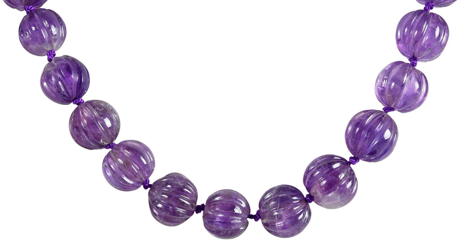 14kt. Large Carved Amethyst Bead Necklace: 24 knotted carved amethyst beads, graduating in sz., 16.5 - 24.0mm, 12 loose beads, oval floral carved amethyst clasp, 28.0 x 21.0mm, marked "14K", yellow gold, 20 in. length, 284.3 g complete weight 