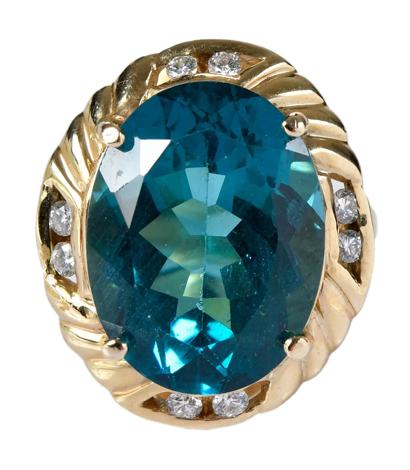 14kt. Large Apatite and Diamond Cocktail Ring: oval facted apatite, approx. 16.25ct., eight round faceted diamonds, approx. 0.40ctw., marked "14K, S", yellow gold, 9 ring sz., 14.0 g Provenance: Private Collection, Virginia Beach Note: Accompanied