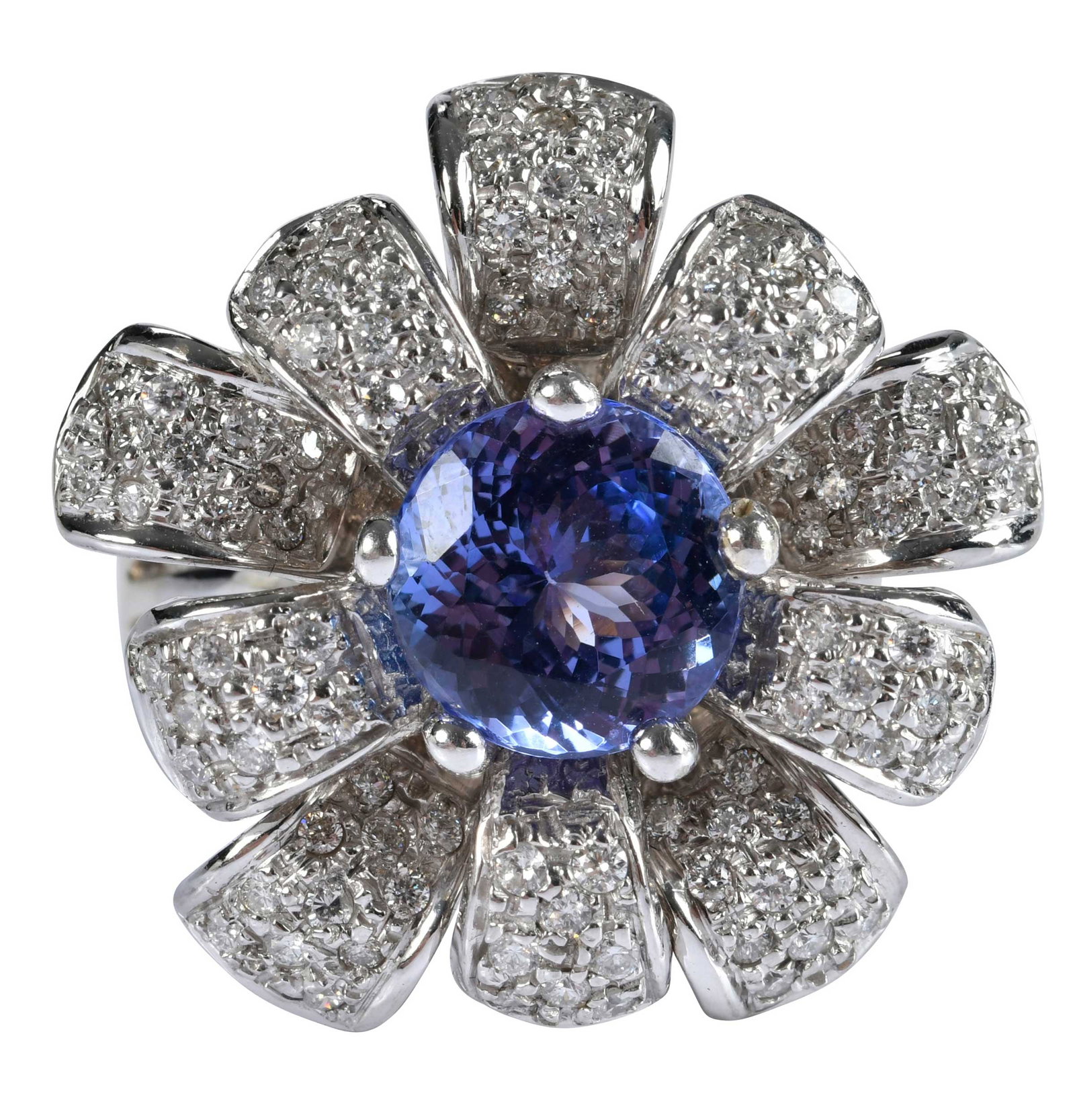 14kt. Flower Tanzanite and Diamond Ring: central round faceted tanzanite, approx. 4.50ct., 95 round faceted diamonds, approx. 1.85ctw., marked "14K", white gold, 11 ring sz., 18.6 g Provenance: Private Collection, Virginia Beach Note: Accomp