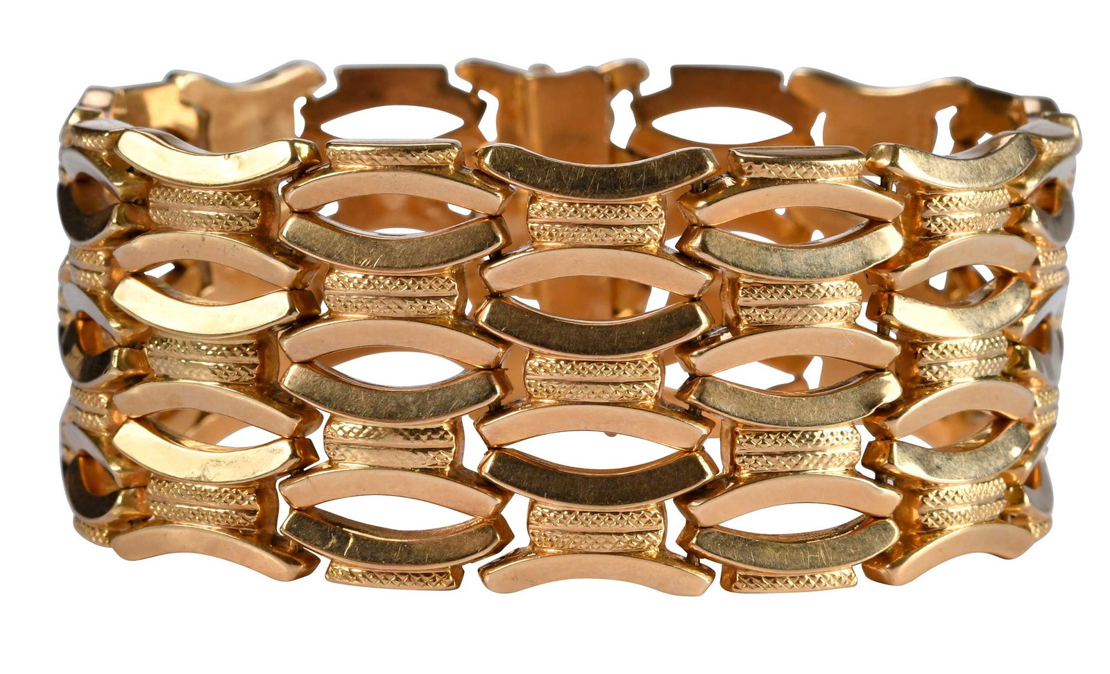 18kt. Italian Wide Fancy Link Bracelet: alternating textured and high polish links, marked "750", yellow gold, 7-1/2 in. length, 1 in. width, 44.0 g Provenance: By Descent in Family Note: Brunk Auctions does not guarantee the accuracy of me
