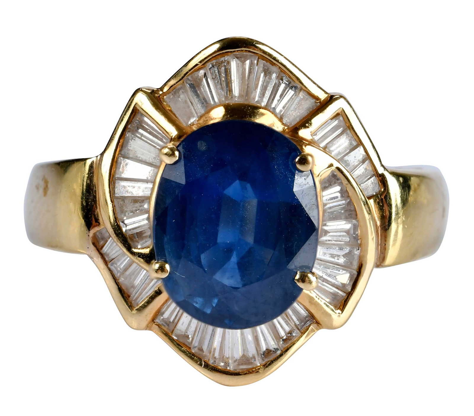 18kt. Blue Sapphire and Baguette Diamond Ring: oval faceted blue sapphire, approx. 3.40ct., 38 baguette cut diamonds, graduating in sz., approx. 0.90ctw., marked "18K, DAVID BR", yellow gold, 8-1/4 ring sz., 8.5 g Provenance: Private Collection, V