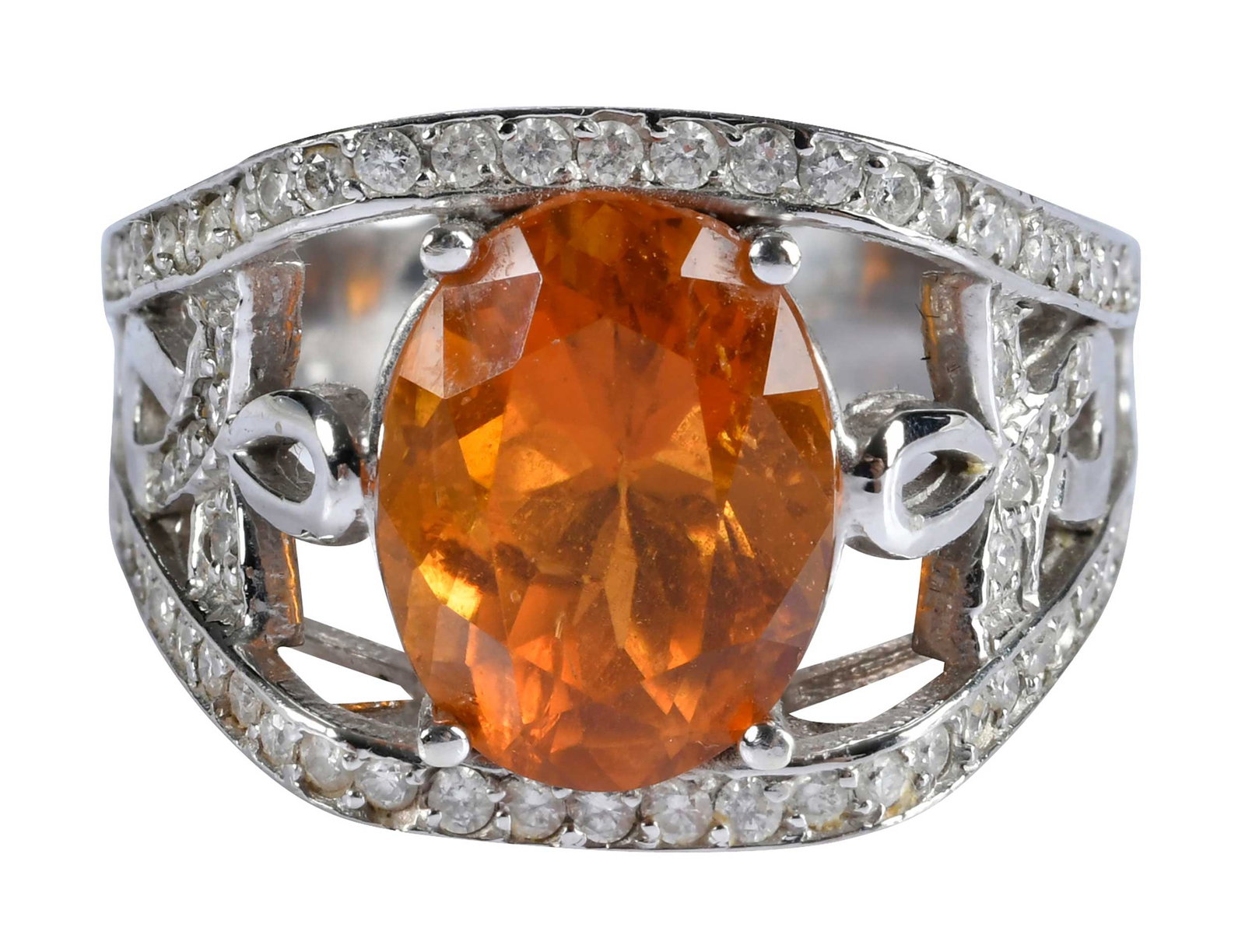 14kt. Oval Clinohumite and Diamond Ring: center oval faceted clinohumite, approx. 5.20ct., round faceted diamonds, approx. 0.60ctw., marked "14K", white gold, 8-1/2 ring sz., 8.6 g Provenance: Private Collection, Virginia Beach Note: Accompa