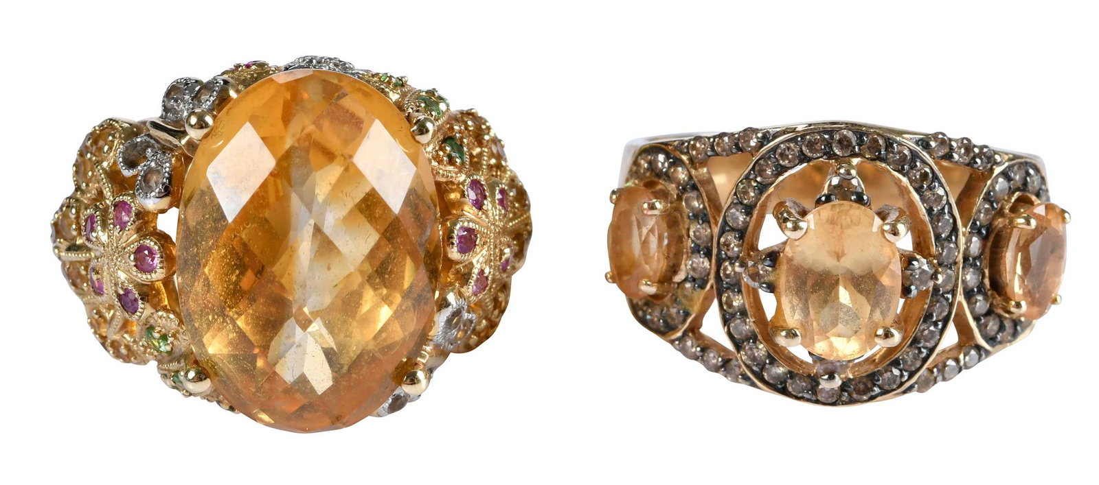Two 14kt. Gemstone and Diamond Fashion Rings, Citrine and Topaz: center oval checkerboard faceted citrine, approx. 11.00ct., round faceted cut rubies, emeralds, white and champagne diamonds, marked "14K, 585", yellow gold, 9-1/4 ring sz., 14.0 g; three modified ova
