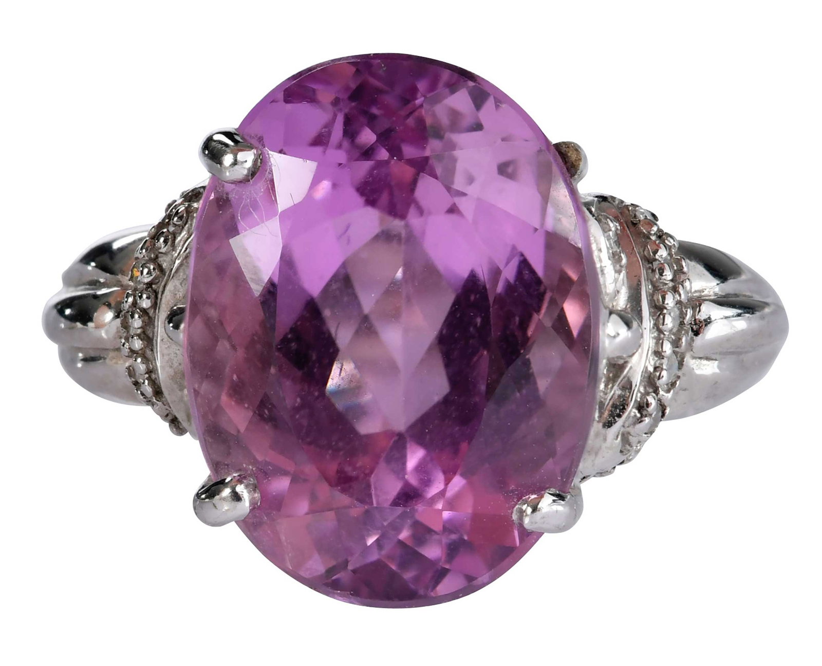 18kt. Mixed Cut Kunzite and Diamond Ring: oval mix cut faceted kunzite, approx. 10.25ct., 14 round single cut diamonds, marked "18K", white gold, 9 ring sz., 10.3 g Provenance: Private Collection, Virginia Beach Note: Accompanied by the curre
