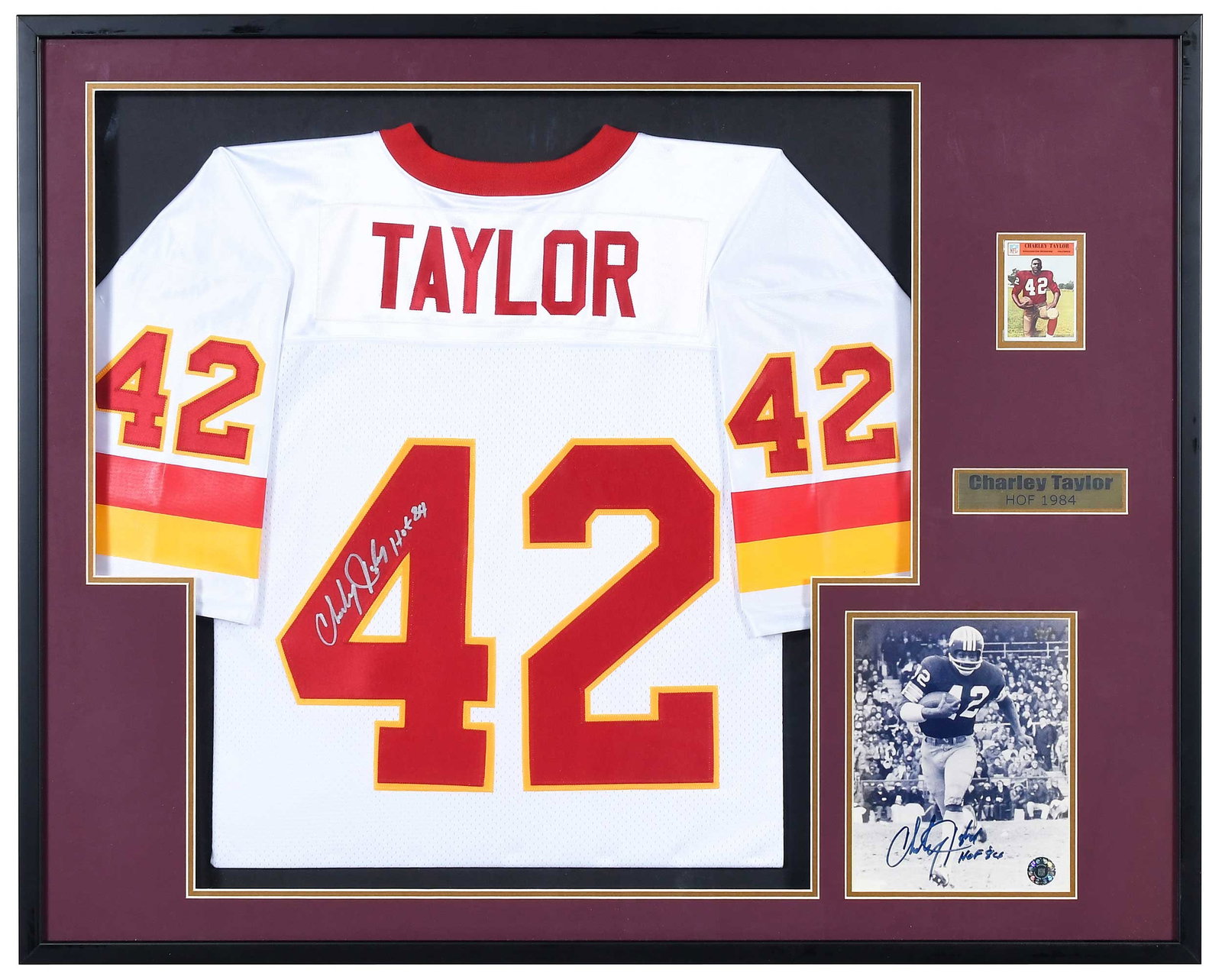 Charley Taylor Signed and Framed Jersey [Redskins]: signed jersey with additional inscription "HOF 84", matted and framed, with football card and signed black and white photo, 2003 show ticket mounted to back of frame, overall approximately 33 x 41 in.