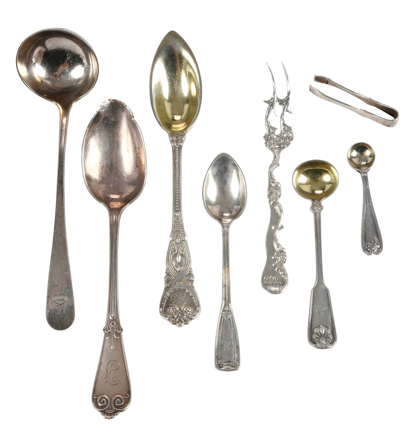 21 Pieces Shiebler and Tiffany Sterling Flatware: American, 20th century, including twelve cocktail forks by George W. Shiebler & Co., 4-1/2 in.; nine Tiffany & Co., spoons, tongs, and one ladle, various patterns, 2 in. to 6 in., 11.64 oz. T. total