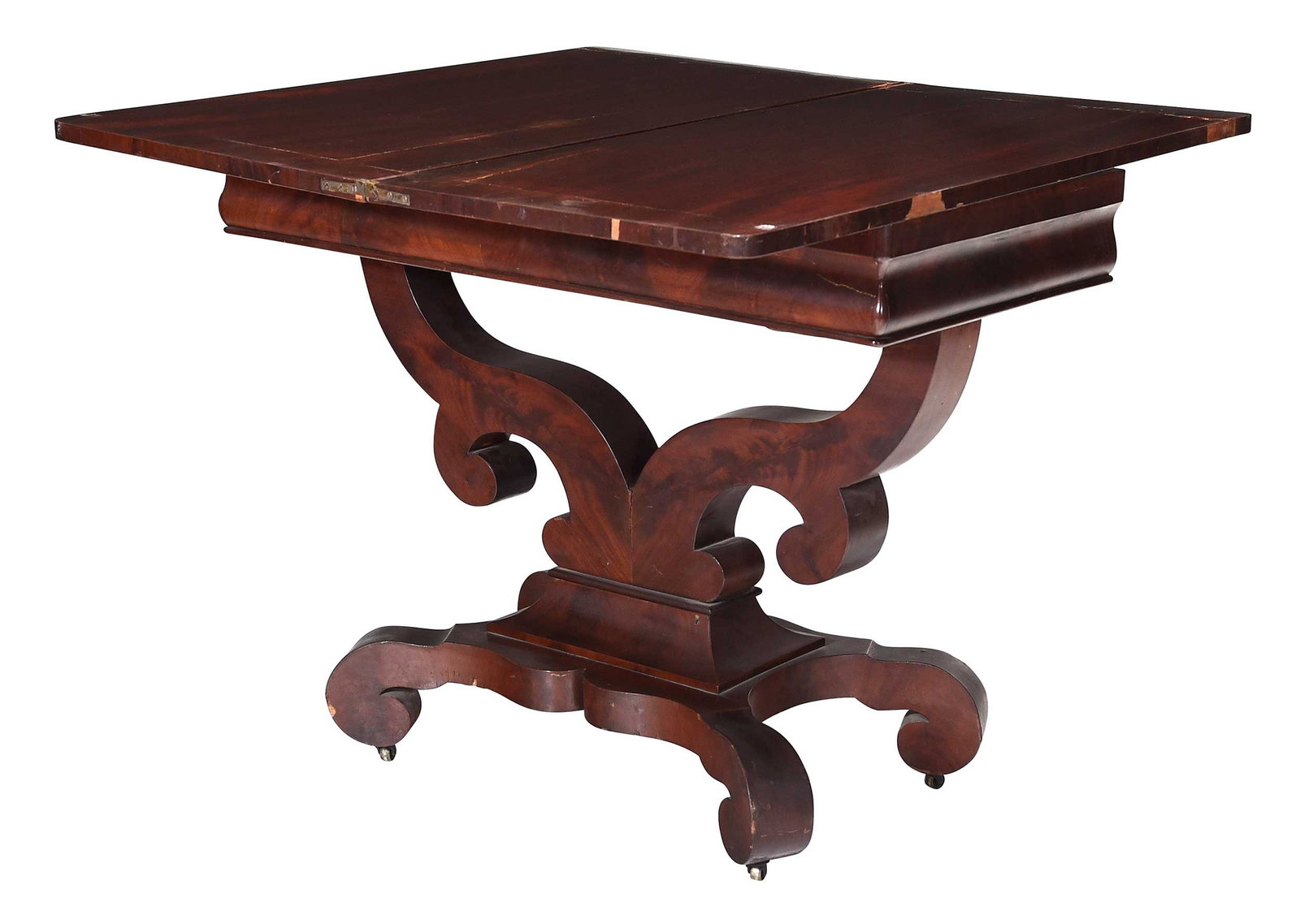 American Classical Figured Mahogany Card Table: probably New York, mid 19th century, figured crossbanded top on shaped split pedestal base, scrolled feet on casters, 29-3/4 x 36 x 17-3/4 in. Provenance: Purchased from Sarah F. Milligan, Saratoga
