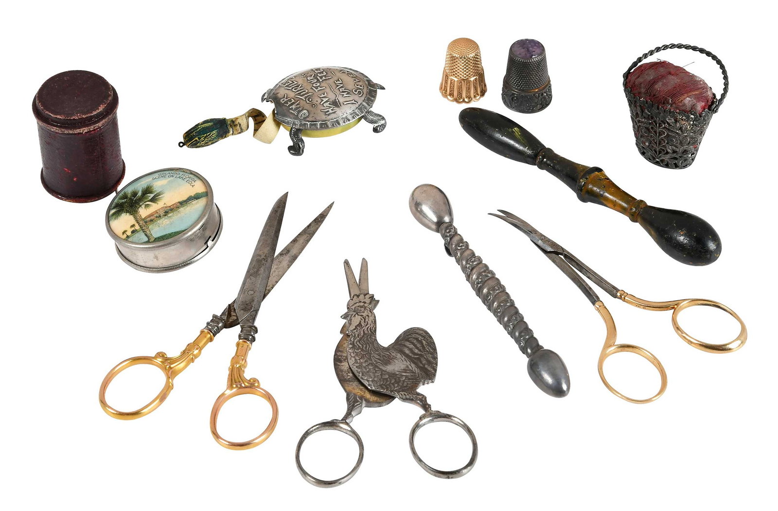 Ten Sewing Silver and Gold Items: 19th/20th century, including two 14kt. yellow gold thimbles, 10.8 grams, one with case; two pairs of scissors with 14kt. yellow gold handles; one sterling thimble, purple tip; silver pin cushion with