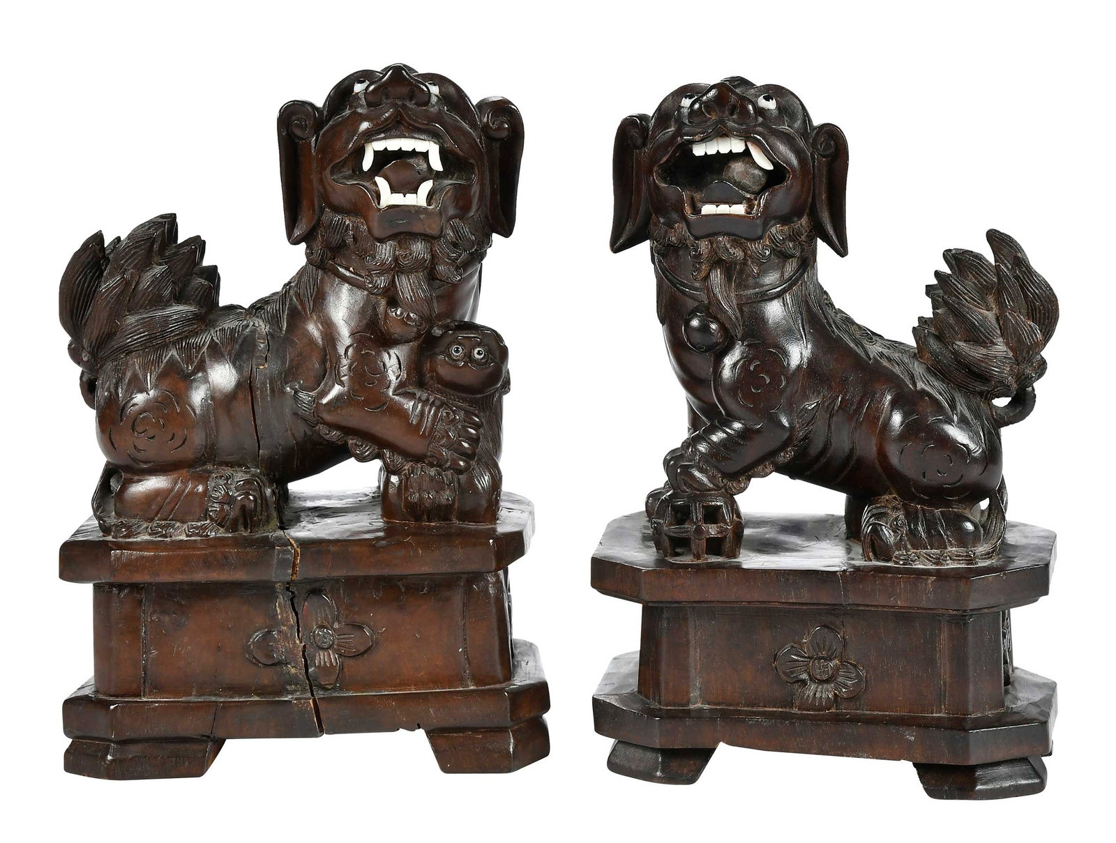 Pair Chinese Carved Lion Figures: 20th century, with inset glass eyes and bone teeth, each 8-1/4 x 5-1/2 x 3-1/4 in. Provenance: Private North Carolina Collection