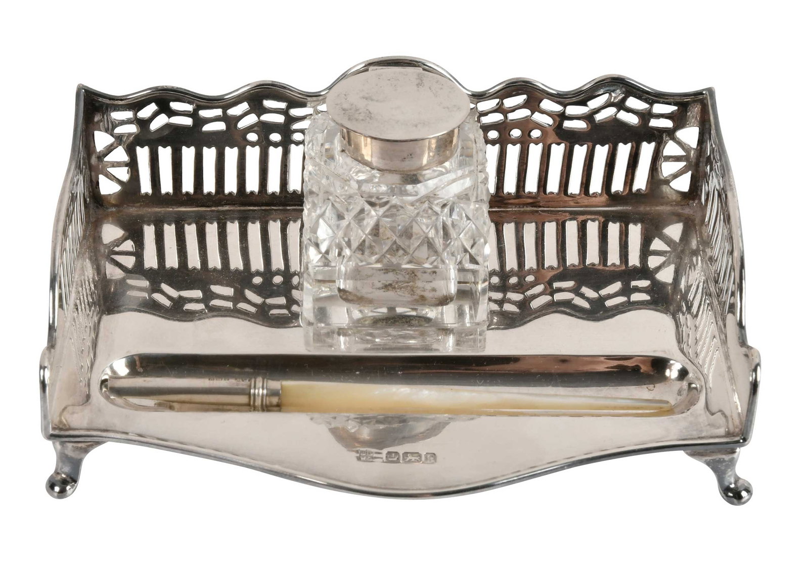 English Silver Ink Stand with Mother of Pearl Handle Pen: Sheffield, 1902, rectangular stand with open work gallery, glass ink well with English silver lid, no monogram, marks for James Deakin & Sons, .925 fine, 4.24 oz. T. stand only, 32-1/2 x 5-1/2 x 4