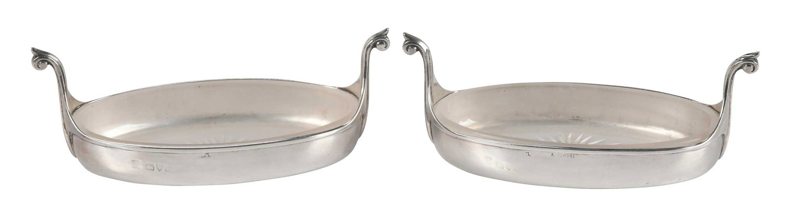 Pair of English Silver Butter Dishes: Chester, 20th century, oval form, fitted glass liners, no monograms, marks for George Edward & Sons, .925 fine, 3.40 oz. T. excluding glass liners, 2 x 5-3/8 x 2-1/2 in. Provenance: Private North