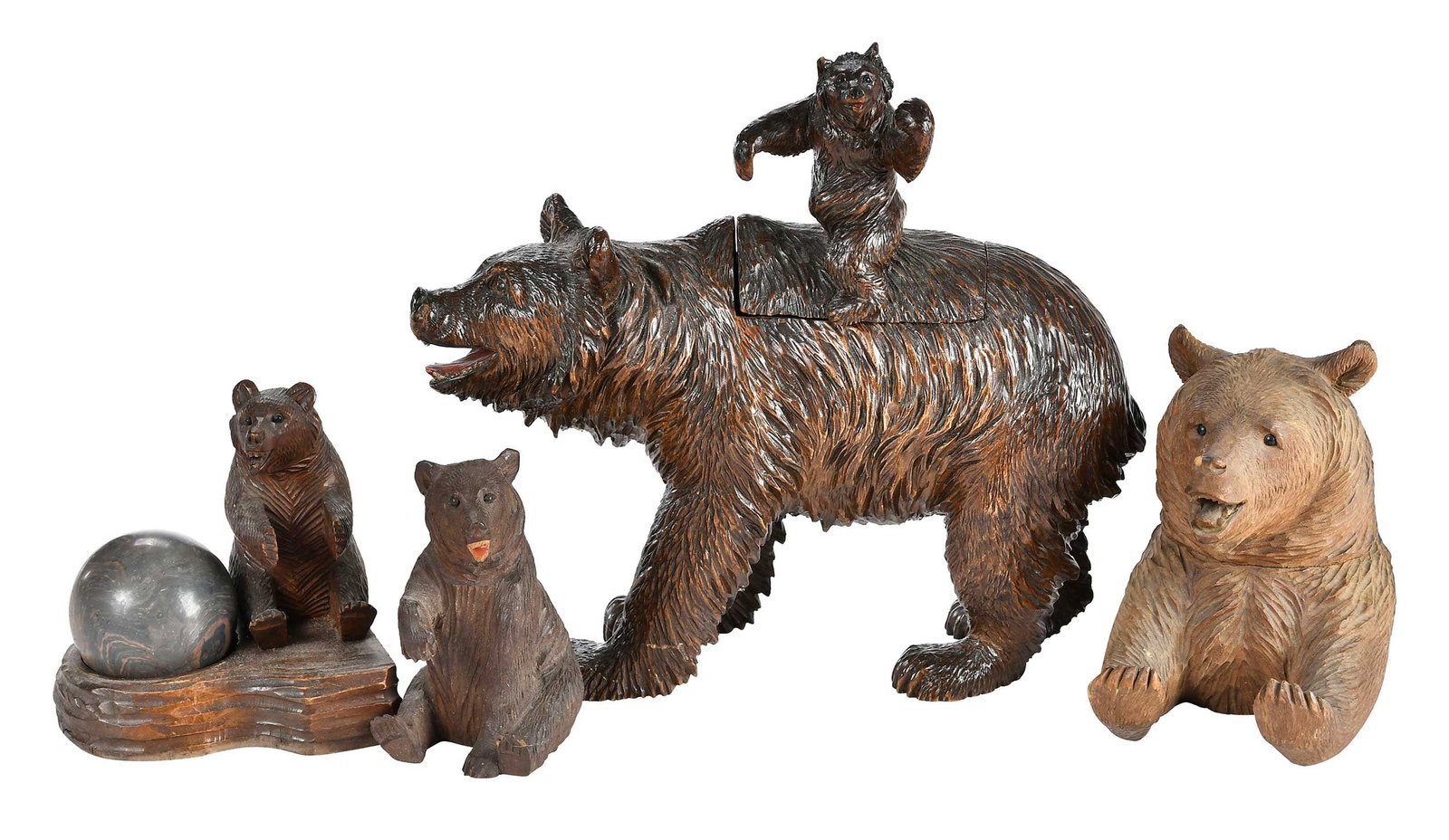 Four Black Forest Carved Bear Form Desk Objects: German, late 19th/20th century, largest 9-1/4 x 10 x 3 in. Provenance: Collection of Steve Stewart, Lake Lure, North Carolina
