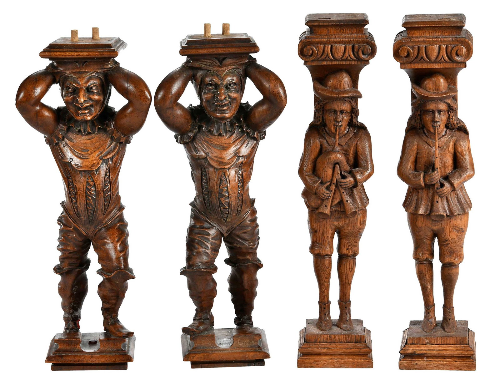 Two Pairs of Continental Carved Figural Furniture Elements: 19th century, pair of pipers and pair of men in caps and boots, larger 16-1/2 x 3-1/2 x 3-3/4 in Provenance: Collection of Steve Stewart, Lake Lure, North Carolina
