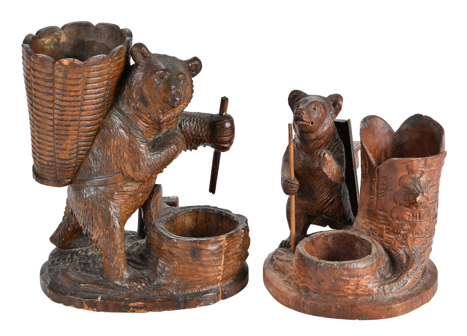 Two Black Forest Carved Bear Form Inkwells: German, 20th century, both in the form of hiking bears with walking sticks on naturalistic bases, larger 7-5/8 x 6-1/4 x 4-1/4 in. Provenance: Collection of Steve Stewart, Lake Lure, North Carolina