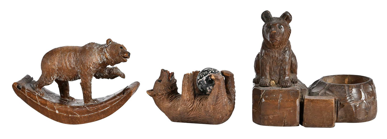 Three Black Forest Carved Bear Form Table Objects: German, comprising: desk curiosity with stone orb; ink blotter with bear form handle; desk caddy; largest 4-3/4 x 5-1/4 x 3-5/8 in. Provenance: Collection of Steve Stewart, Lake Lure, North Carolina