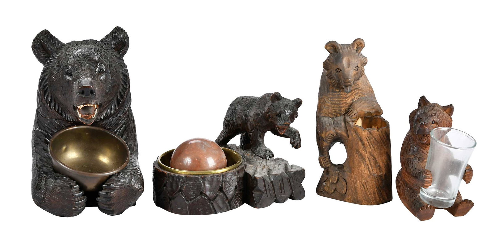 Four Black Forest Carved Bear Form Desk Objects: German, late 19th/20th century, largest 7 x 4-1/4 x 6-1/2 in. Provenance: Collection of Steve Stewart, Lake Lure, North Carolina