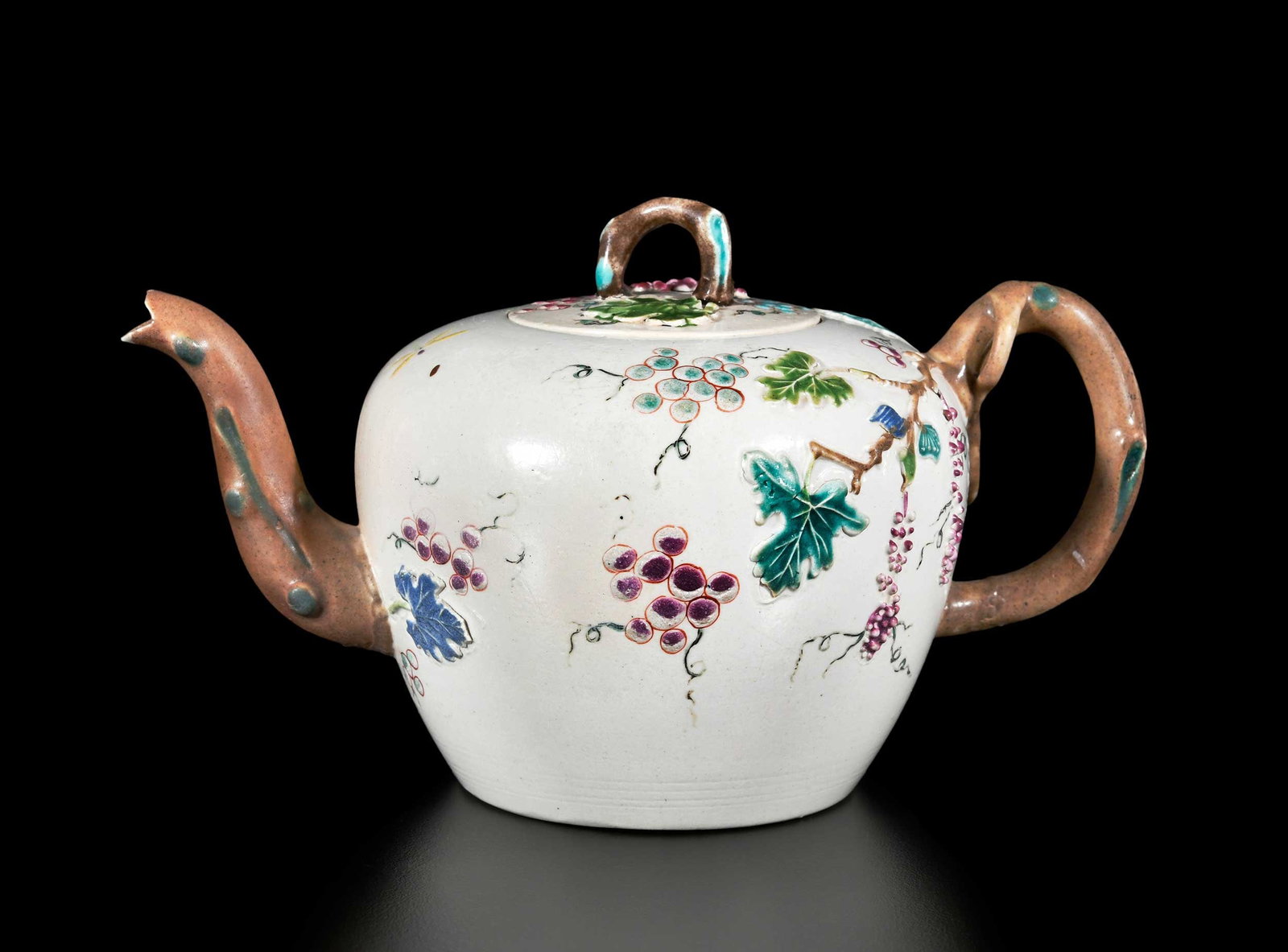 English Staffordshire Salt Glazed Stoneware Teapot, Atkins Provenance: mid 18th century, grapevine sprigging and bird chasing a dragonfly, crabstock handle and spout, 4-1/4 x 7 x 4 in. Provenance: Garry Atkins, London, March 2023 (accompanied by copy of receipt for $1,50