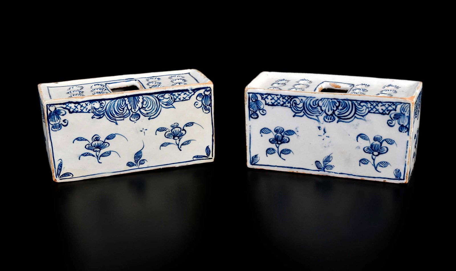 Pair of English Delftware Flower Bricks, Horne Provenance: London or Liverpool, mid 18th century, each with blue and white floral decoration, 2-1/2 x 4-3/4 x 2 in. Provenance: Jonathan Horne Antiques, London, March 2004 (accompanied by copy of receipt for GBP