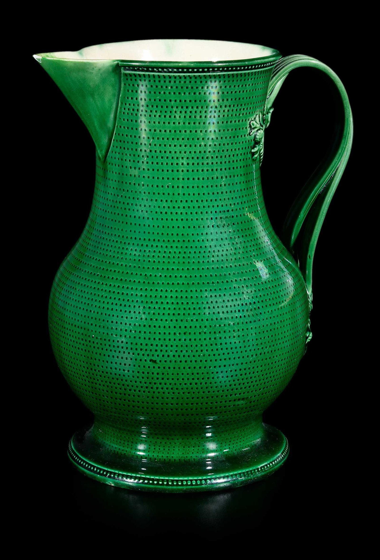 English Green Glazed and Rouletted Creamware Jug, Horne Provenance: possibly Yorkshire, mid 18th century, fine, thinly potted form with bright apple green glaze, double entwined strap handles, 6-7/8 x 5-5/8 x 4-1/2 in. Provenance: Jonathan Horne Antiques, London, Janu