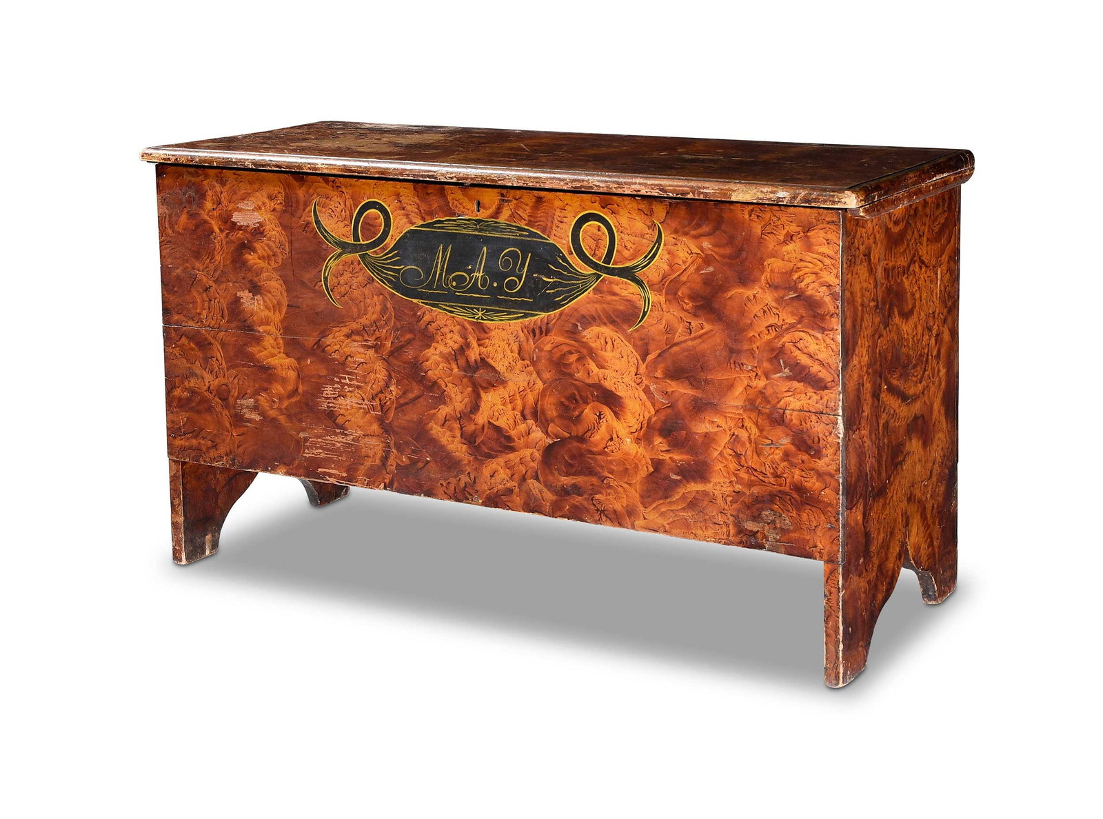 Fine American Folk Art Paint Decorated Lift Top Chest: Rhode Island or Connecticut, circa 1825, yellow pine, sponge decorated ochre and brown, initialed "M.A.Y" to the front, 22-3/4 x 42 x 16-3/4 in. Provenance: From the Collection of Elbert H. Parsons, J