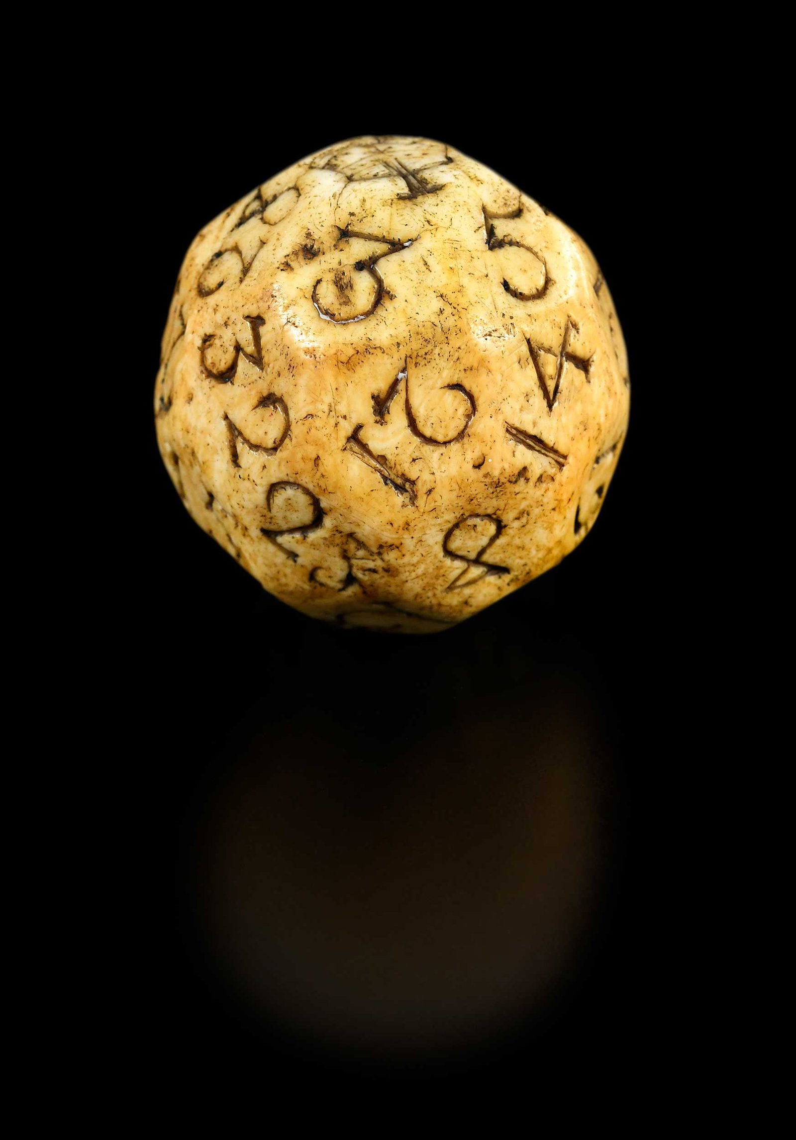 Rare Charles II Carved Bone Sailors 32 Side Teetotum: British, mid 17th century, crown to the "1" facet, rich dark golden color and patina, 1-7/8 x 1-7/8 x 1-7/8 in. Provenance: Hollis E. Brodrick, Portsmouth, New Hampshire, October 2022 (accompanied by 