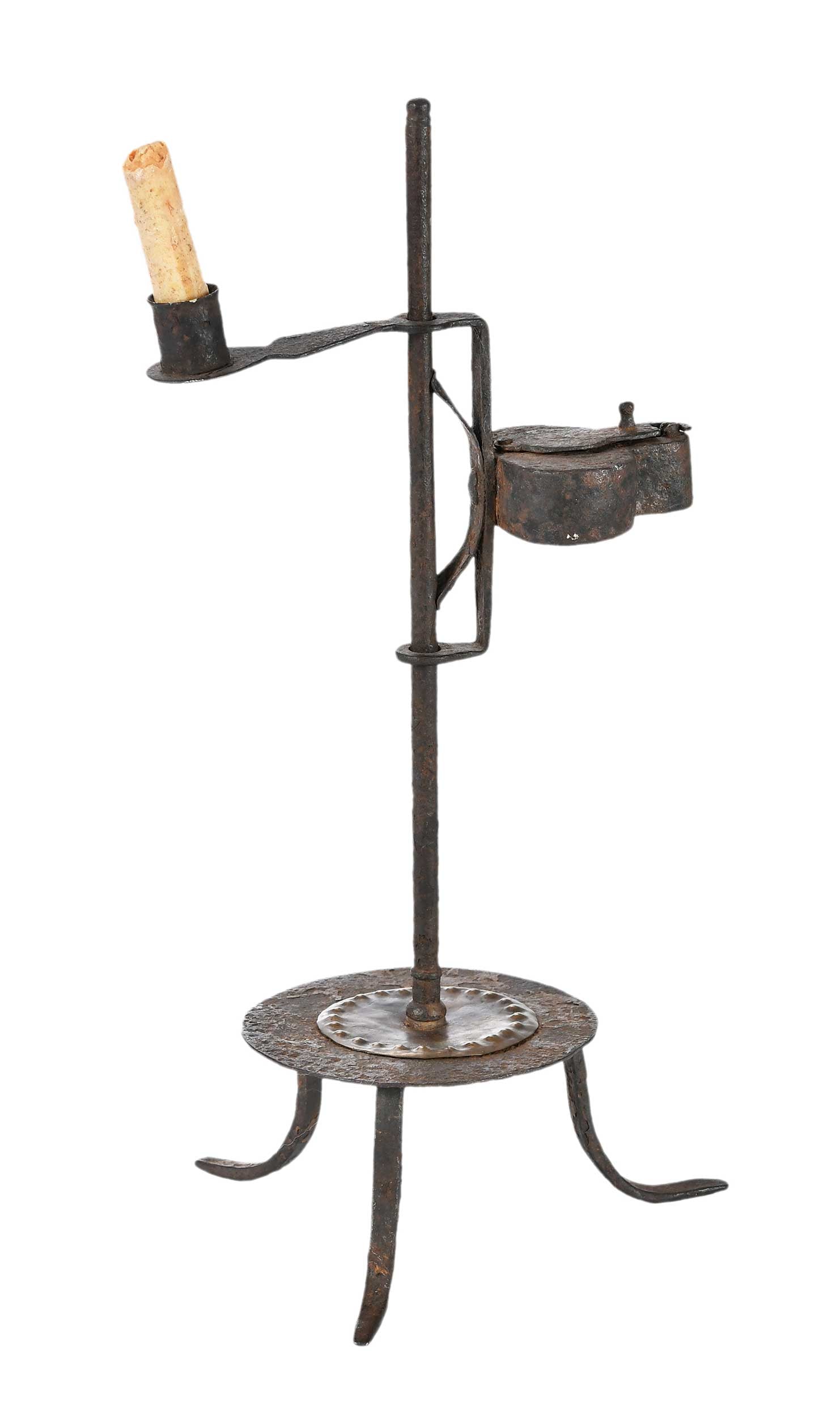 Early Iron Adjustable Combination Betty Lamp and Candleholder, Kindig Provenance: 18th century, wrought iron and brass, with candle socket and Betty lamp on vertical shaft, punched brass plate to base, antique partial candle included, 16 x 7-1/2 x 7-1/2 in. Provenance: Joe Kindig A