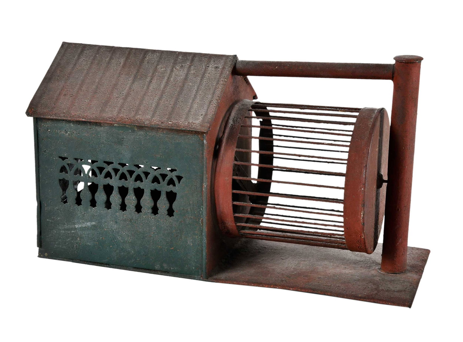 Paint Decorated Sheet Metal Squirrel Cage in Original Red and Green Paint: English or American, 19th/early 20th century, red and green painted diminutive house form enclosure with pierced sides and running wheel, 5-1/2 x 9-1/2 x 3-3/4 in. Provenance: John Sideli, North Egrem