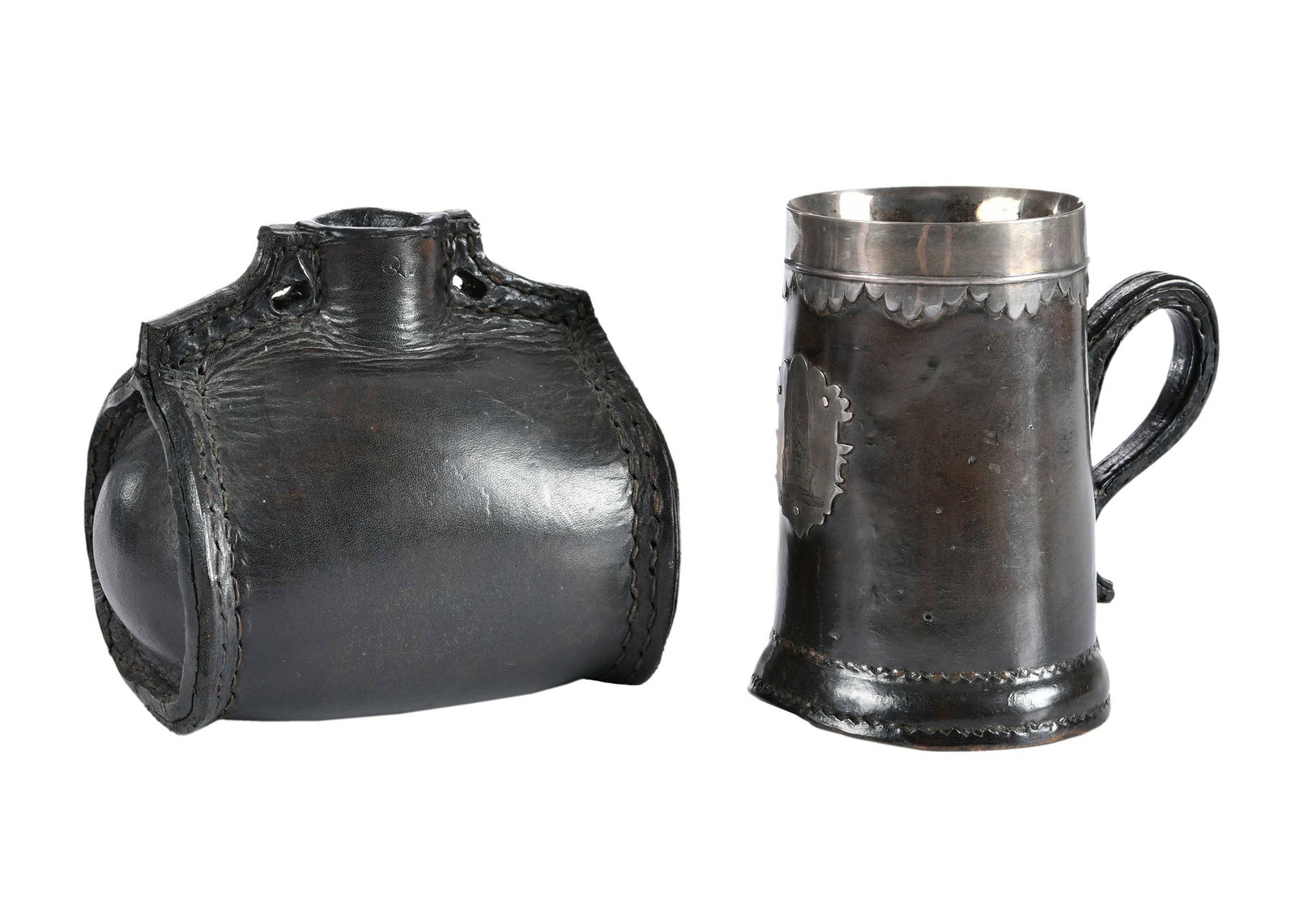 Two Early English Leather Drinking Vessels: 18th century, comprising: silver mounted tankard, escutcheon engraved with the crest of Admiral Sir Thomas Pasley, Baronet (1734-1808), 5-1/2 x 5-1/4 x 4 in.; costrel/bottle, 5-3/4 x 5-1/2 x 4-3/4 in.