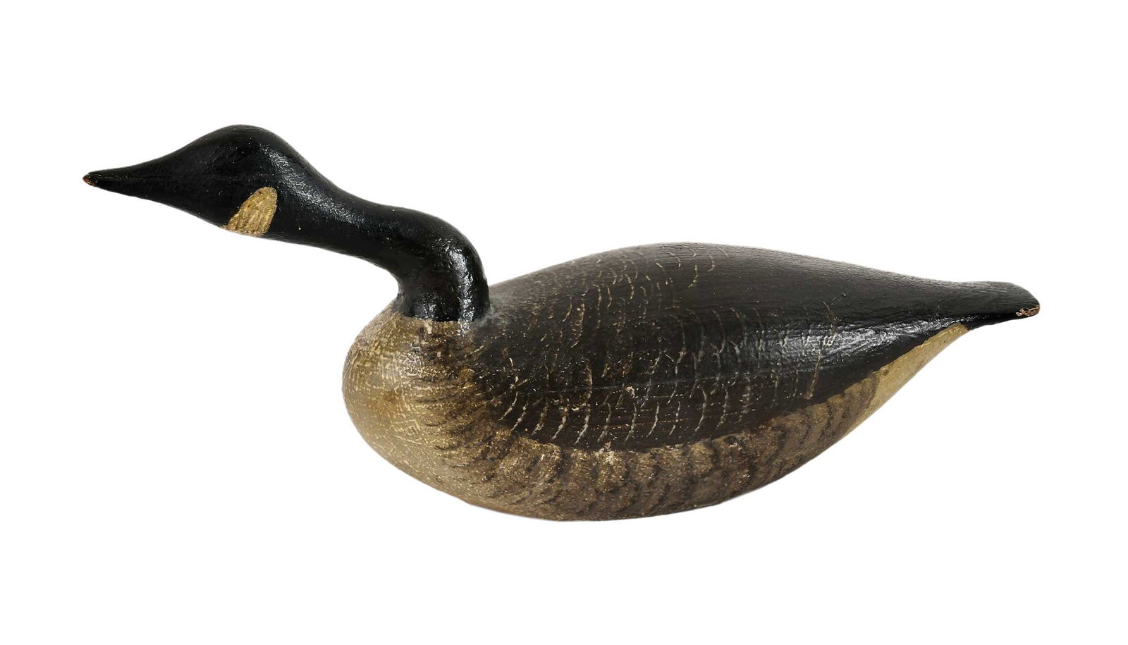 Joseph Lincoln Attributed Miniature Hissing Canada Goose Decoy: Accord, Massachusetts, finely painted, pencil inscription at base "1932 Joe Lincoln WCG," 2-3/4 x 6-1/4 x 1-3/4 in. Provenance: June Lambert American Antiques, Alexandria, Virginia, December 1995 (acc