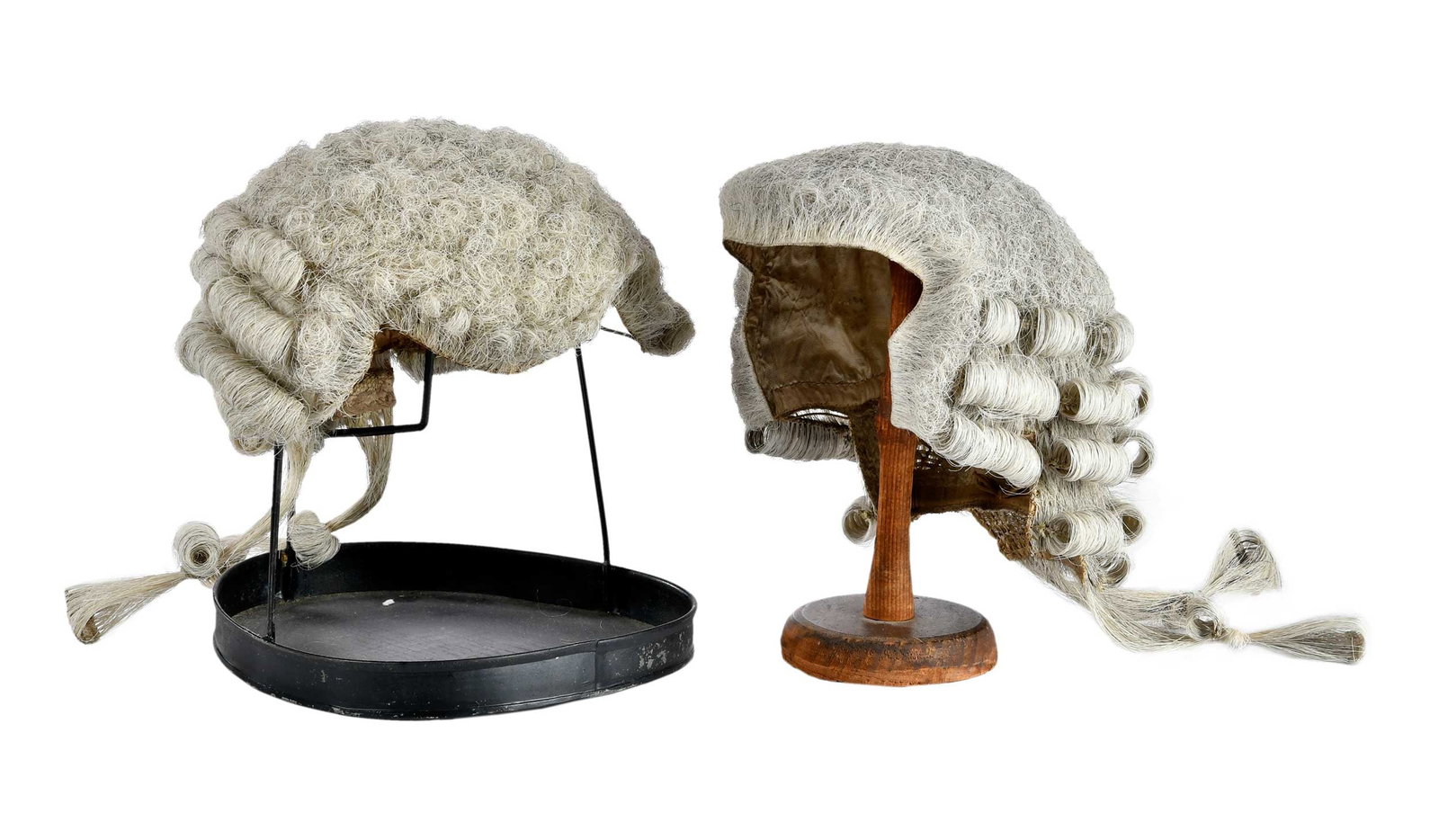 Two 19th Century Gentleman's Court or Barrister Wigs on Stands, Sotheby's Provenance: London, horsehair, manufacturers labels stitched to interiors; pine stand; tin stand; larger wig on stand approx. 10 x 8-1/2 x 8-3/4 in. Provenance: Merton A. Thomas, Esquire, London; David R. Hillier