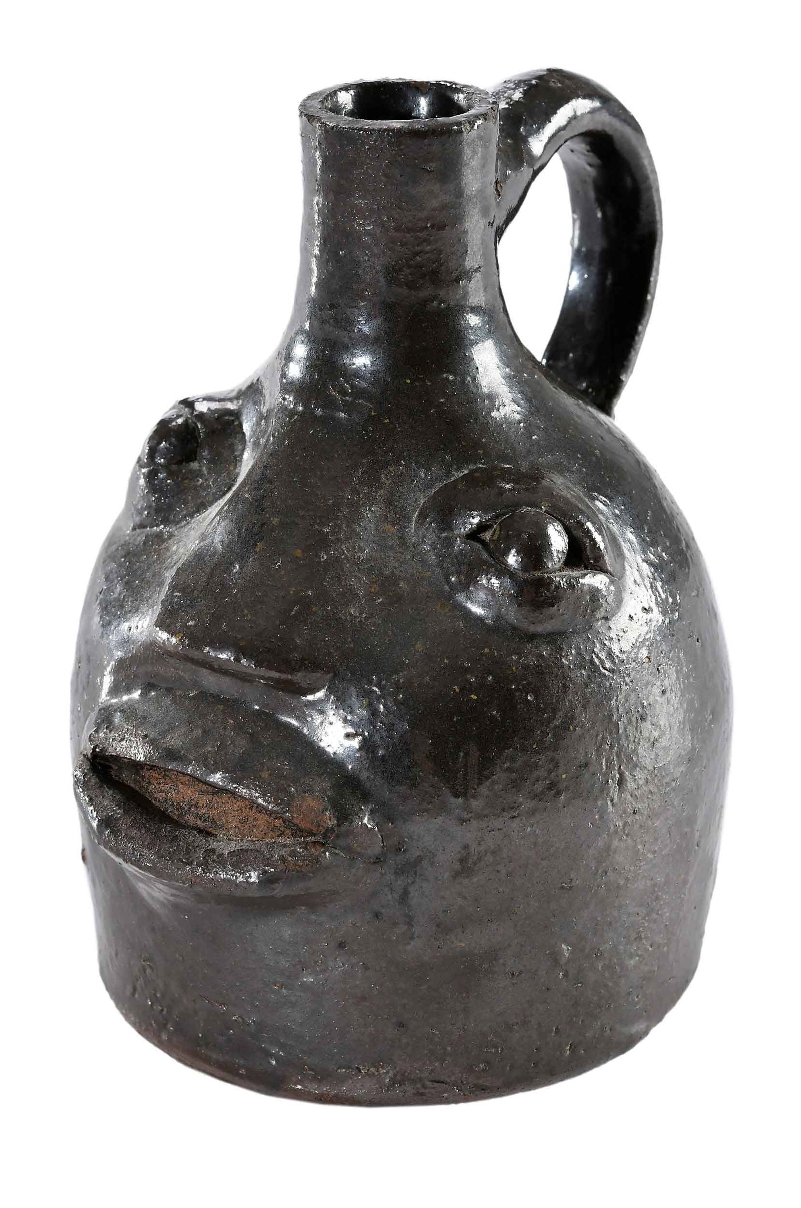 Rare Small W.T.B. Gordy Attributed Georgia Stoneware Face Jug: (William Thomas Belah Gordy, Alvaton, Aberdeen, and Greenville, Georgia, 1877-1955) circa 1950, Albany slip glaze, applied facial features including inset eyes, pronounced lips, broad flat nose, long 
