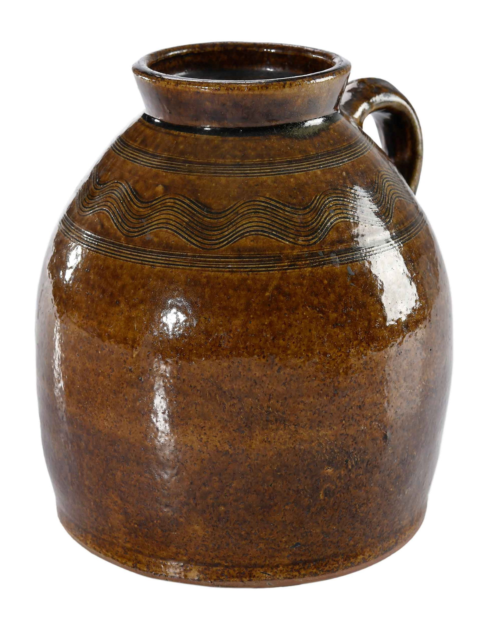Sand Mountain Alabama Decorated Stoneware Jar: Sand Mountain, DeKalb County, mid to late 1800s, yellowish orange alkaline glaze, tapered shoulder form, combed banded wavy line decoration at shoulder, arched applied strap handle with impressed tail