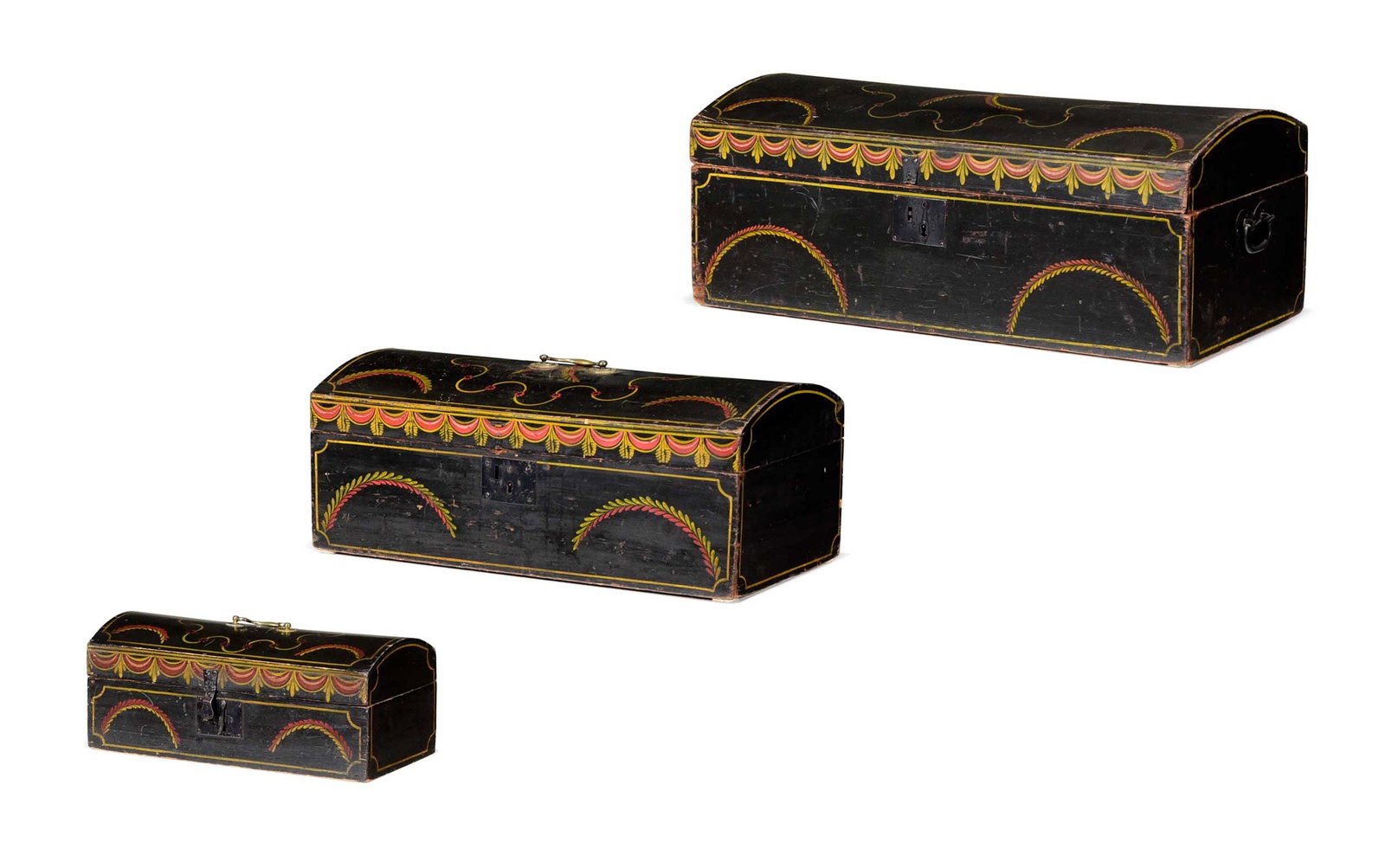 Very Rare Nest of Three Graduated Folk Art Paint Decorated Dome Top Boxes: 19th century, each of rectangular form with domed hinged lid over open interior, iron and brass hardware, black painted ground with red and gold painted swags, largest 11-1/4 x 28 x 14 in. Provenance: