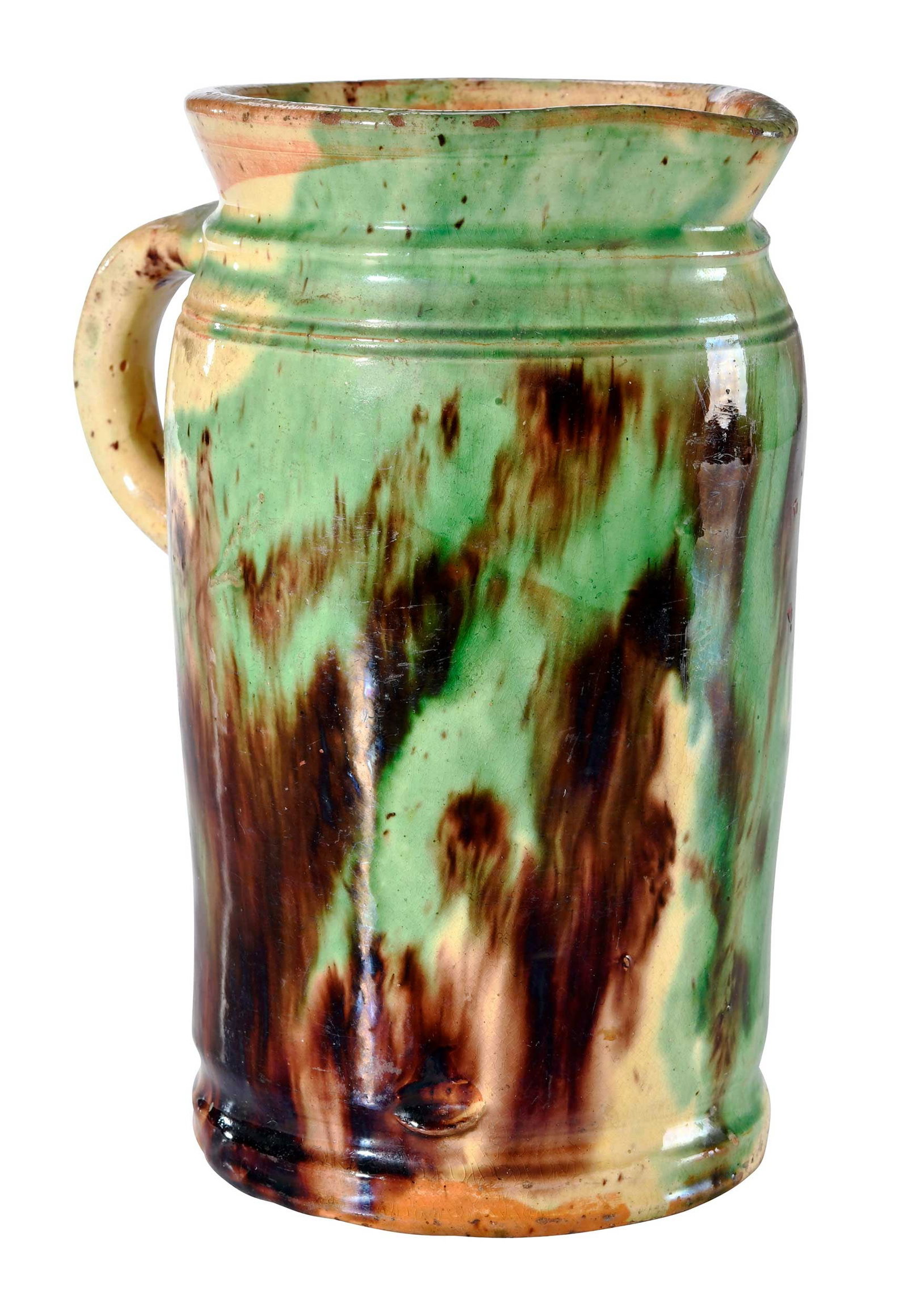J. Eberly & Co. Strasburg, Virginia Attributed Earthenware Pitcher: Shenandoah Valley, circa 1885-1899, engobe glaze with copper, manganese, and lead dioxide, cylindrical form with rounded shoulder, tooled footed base with impressed lower edge, incised band at ridged 