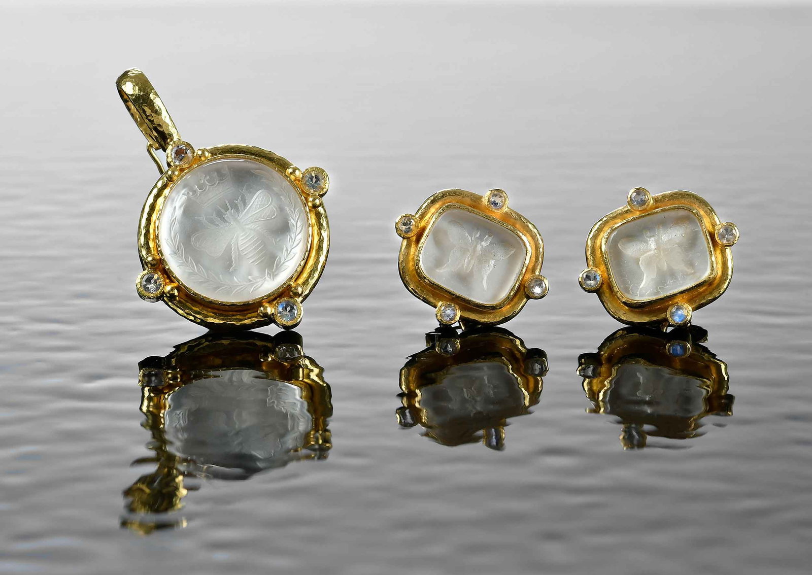 19kt. Elizabeth Locke Venetian Glass Intaglio Suite, Earrings and Pendant: crystal Venetian glass intaglios backed with mother of pearl "Butterfly", eight round faceted moonstone accents, marked "19K", yellow gold, maker's mark, omega back with fold down post, 20.0 x 23.0mm,