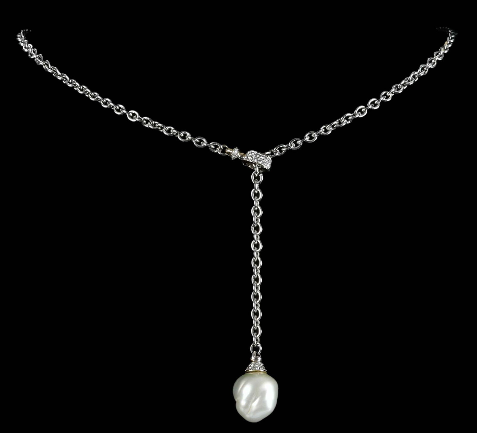 18kt. Baroque Pearl Drop with Diamond Accent Lariat Necklace: large baroque pearl, approx. 16.0mm, round faceted diamonds, approx. 0.50ctw., VS, G-H, marked "750, 045", white gold, 28 in. length with adjustable lariat length, 23.8 g Provenance: Collection of Dr.