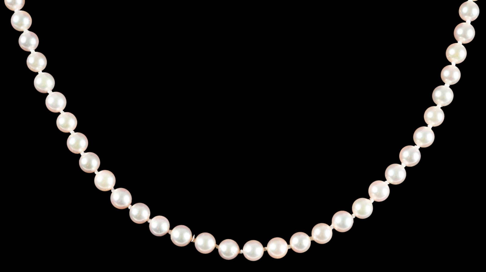 18kt. Mikimoto Pearl Strand: white lustrous pearls, 6.0 - 6.5mm, marked "M, 750", yellow gold clasp, 20 in. length, 26.5 g Provenance: Collection of Dr. George and Connie Manger Note: Brunk Auctions makes no warranty or