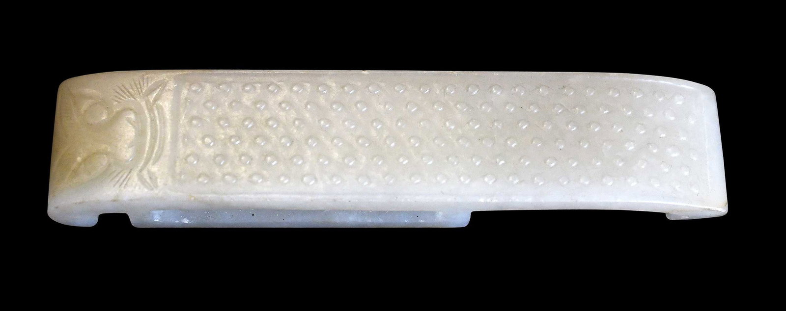 Chinese Carved Jade Sword Fitting: pale green, pebbled texture and taotie mask, 4 x 7/8 x 1/2 in. Provenance: The Collection of William S. Arnett, Atlanta, Georgia; sold to benefit Tinwood Foundation Note: This item tested as nephrite 