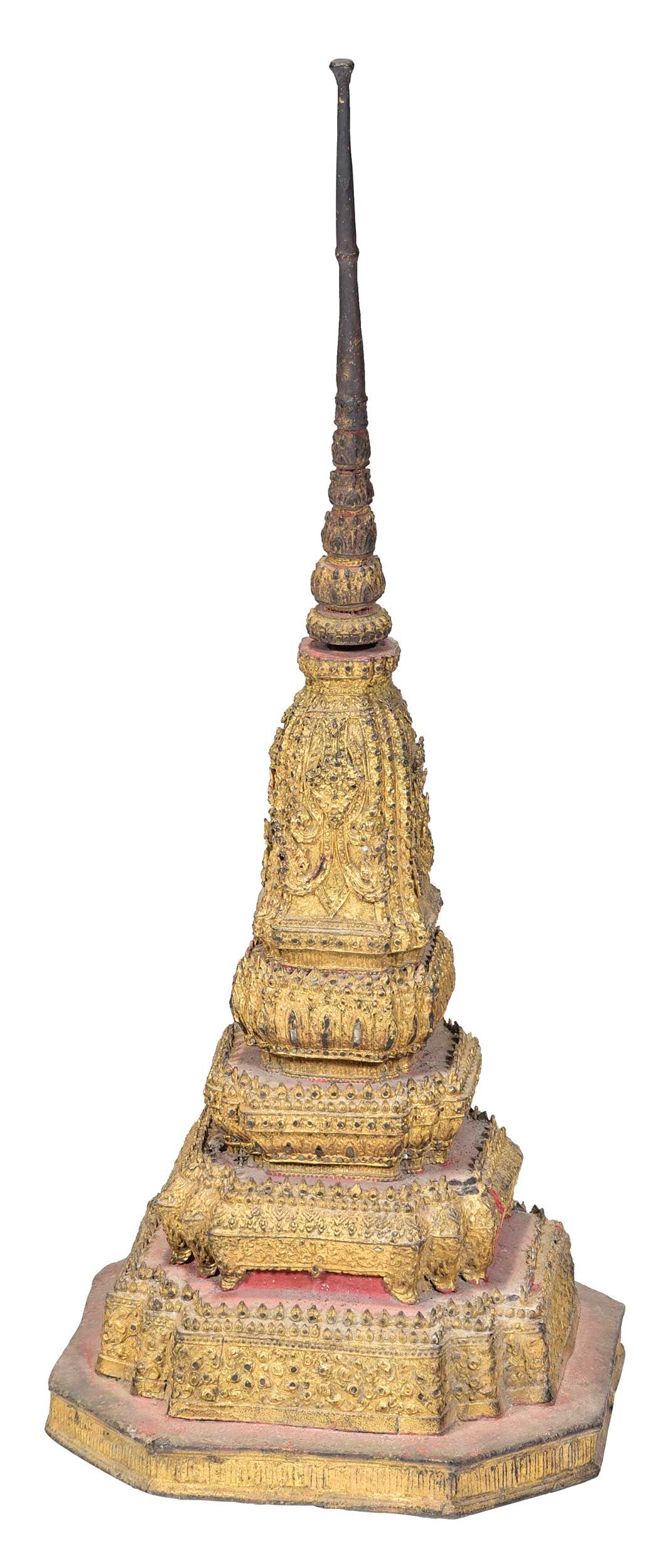 Thai Gilt Bronze Buddhist Stupa: 19th century, late Rattanakosin Kingdom, remnants of red pigment, ornate tiered base with removable top, 24 x 9-1/4 x 9-1/4 in. Provenance: The Collection of William S. Arnett, Atlanta, Georgia; sold 