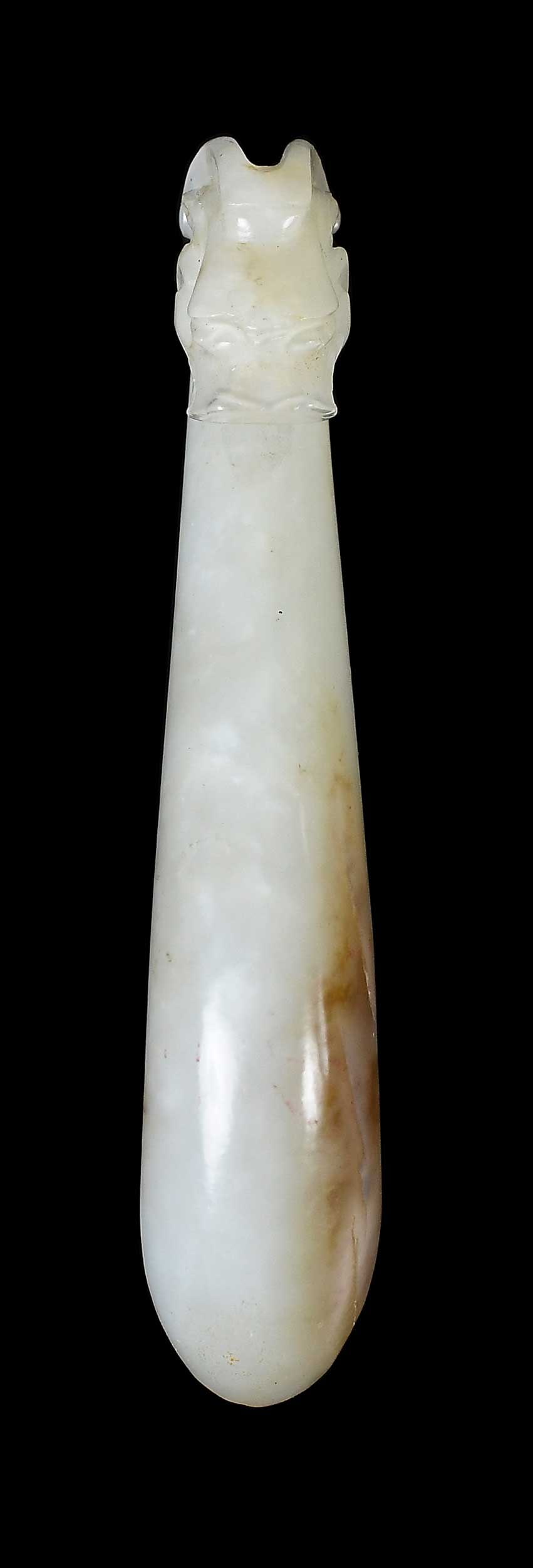Chinese Carved Jade Belt Hook: qiulong (horned dragon) head motif in pale green jade with brown inclusions, 3-1/2 x 5/8 x 7/8 in. Provenance: The Collection of William S. Arnett, Atlanta, Georgia; sold to benefit Tinwood