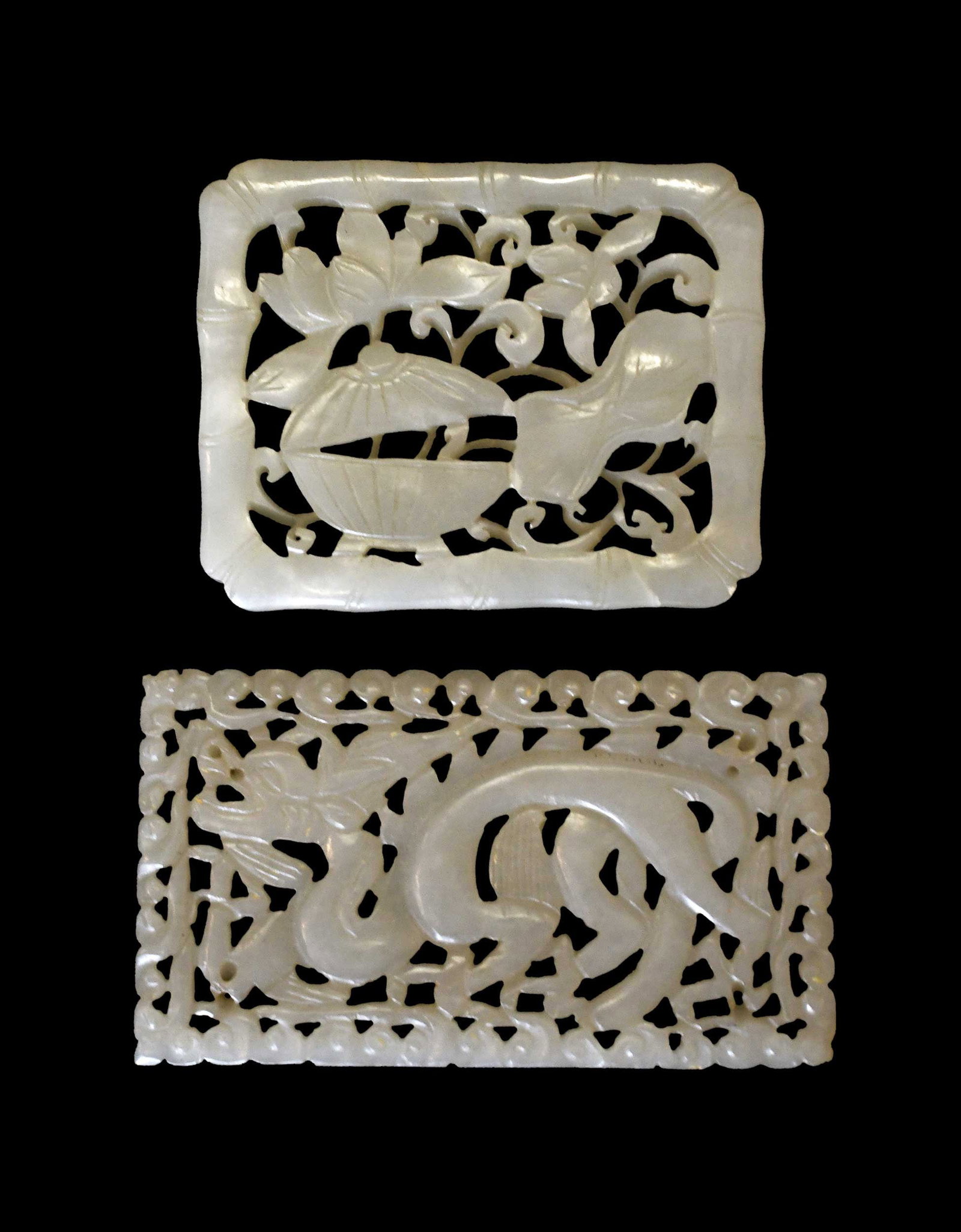 Two Chinese Carved Pale Green Jade Plaques: one with openwork decoration of a dragon, one with floral openwork decoration, larger 3-1/8 x 1-7/8 x 1/8 in. Provenance: The Collection of William S. Arnett, Atlanta, Georgia; sold to benefit Tinwood